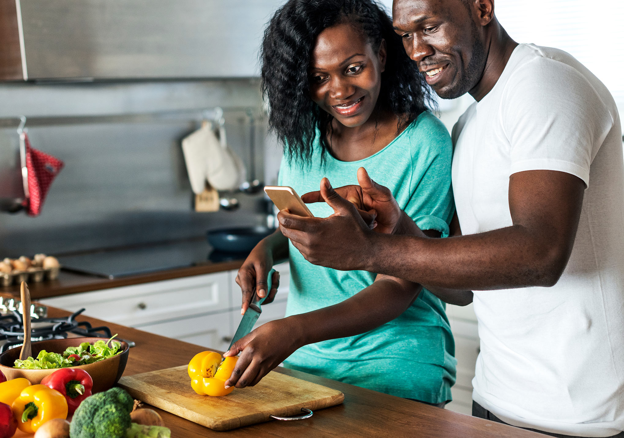 A busy couple planning healthy meals together