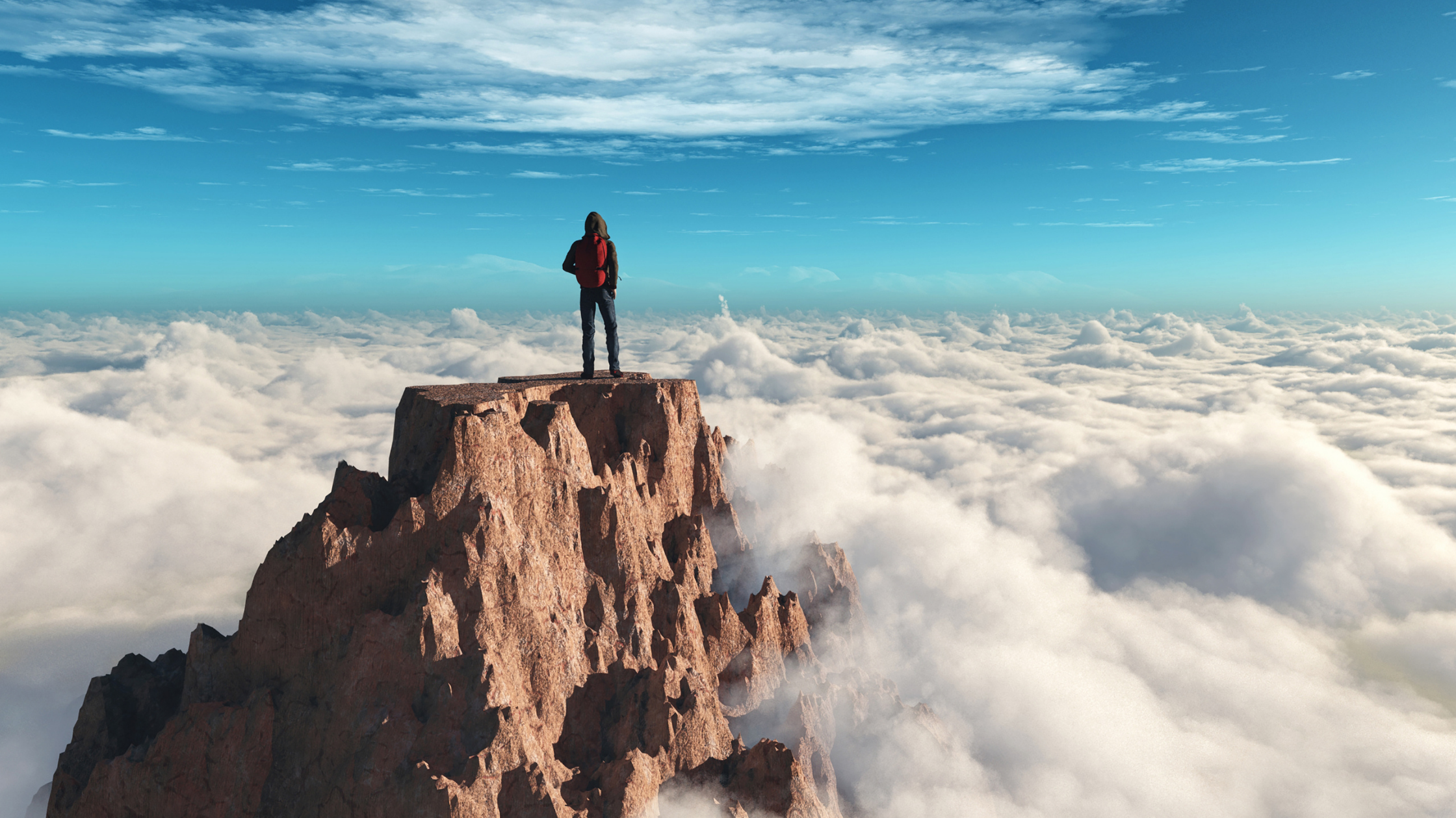 Picture of person standing on mountain high above the clouds