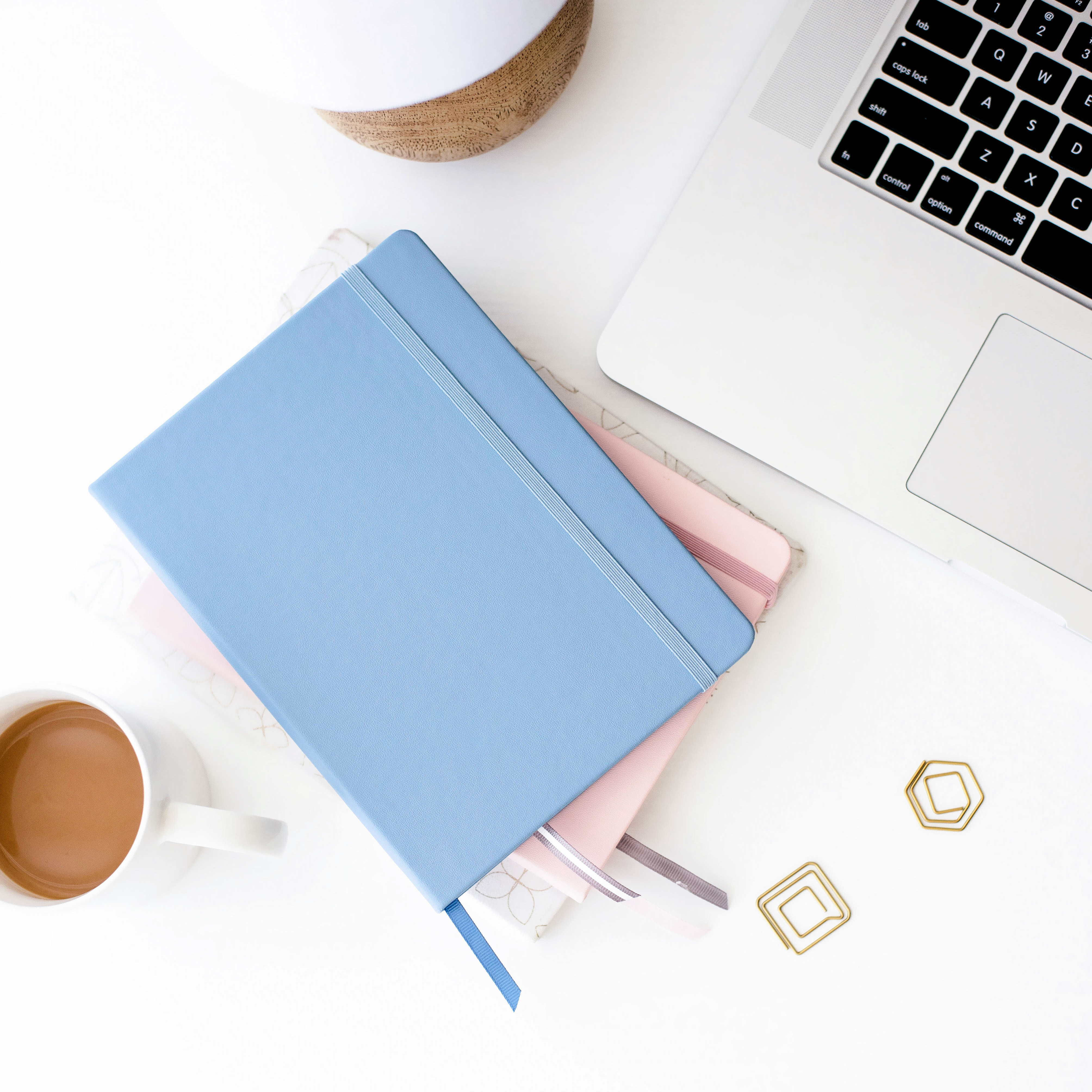 Blue and pink journal on a desk