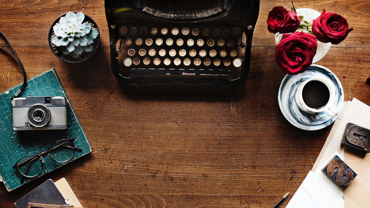 typewriter with camera and coffee cup