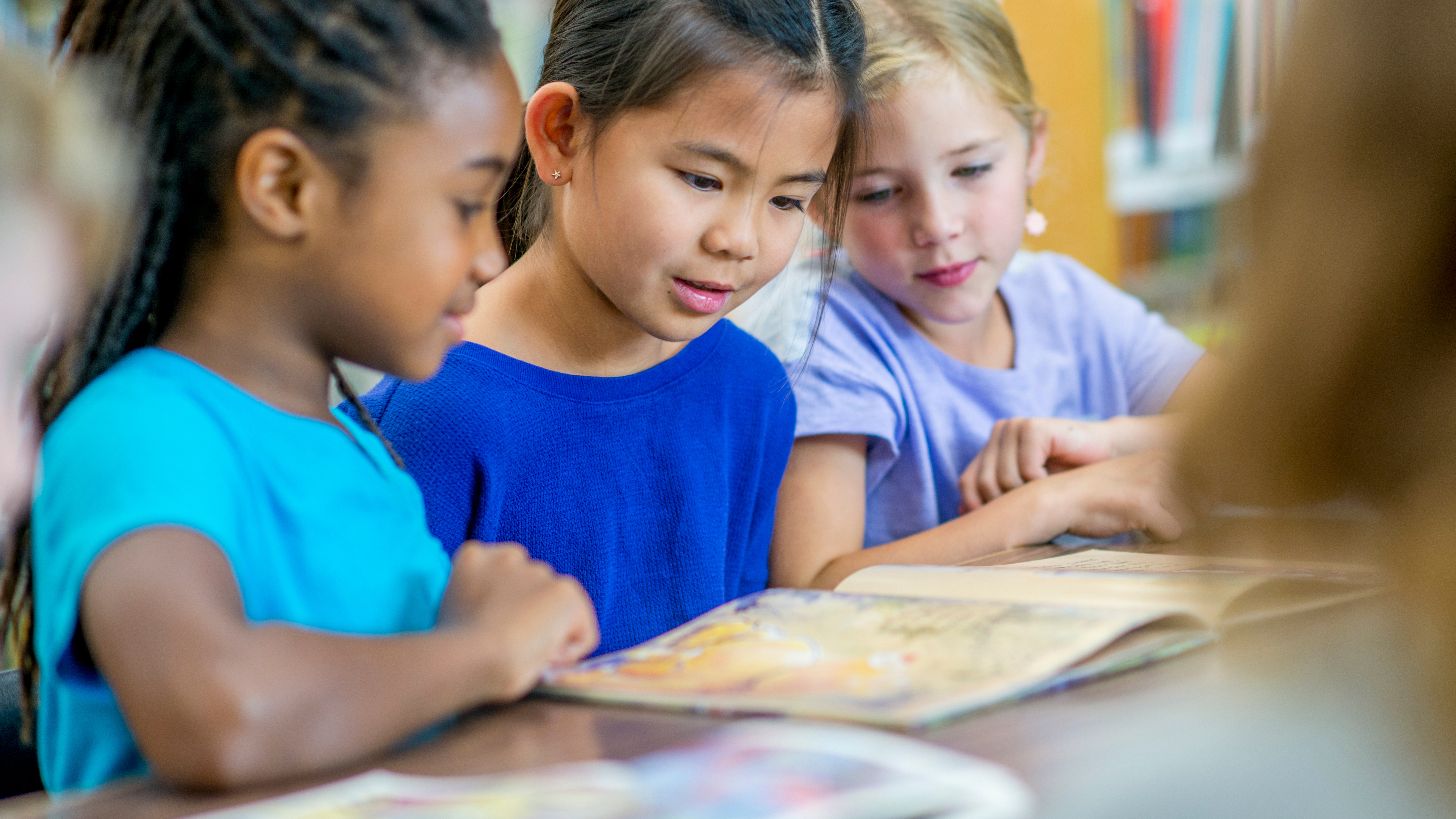 students reading picture book