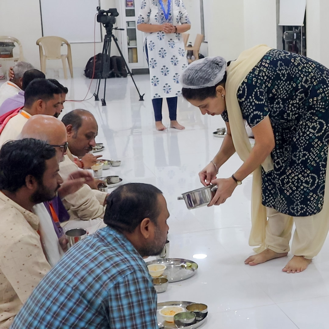 Sadhak serving the food to Brahmans