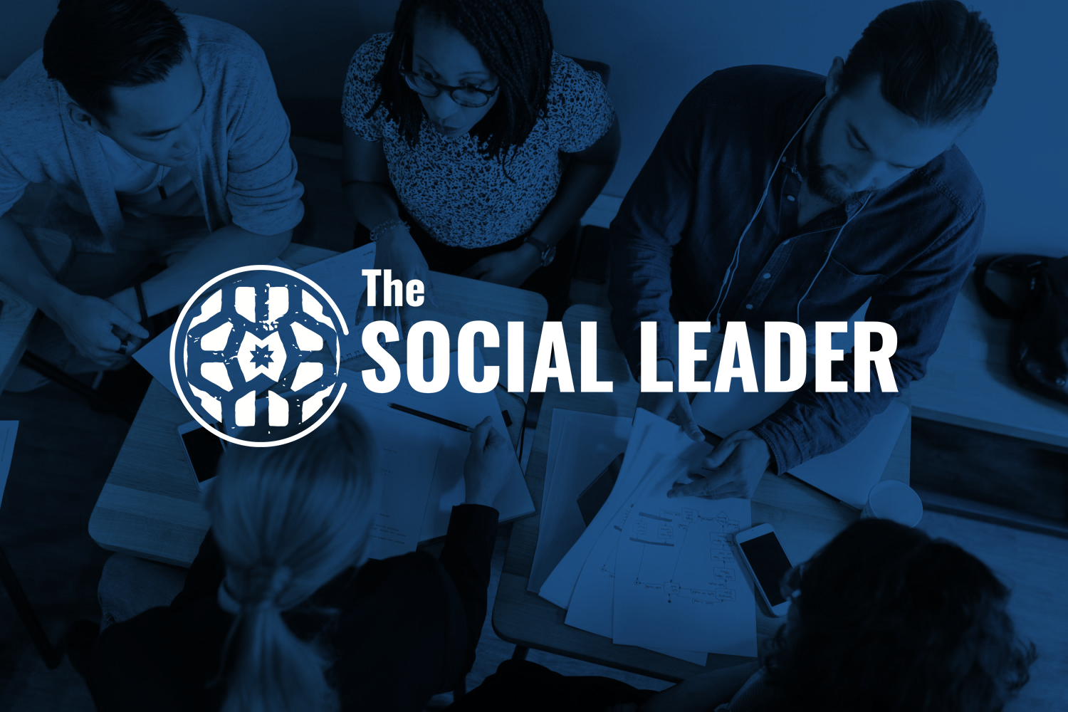 The Social Leader logo overlaying an image of an active business meeting at a conference table