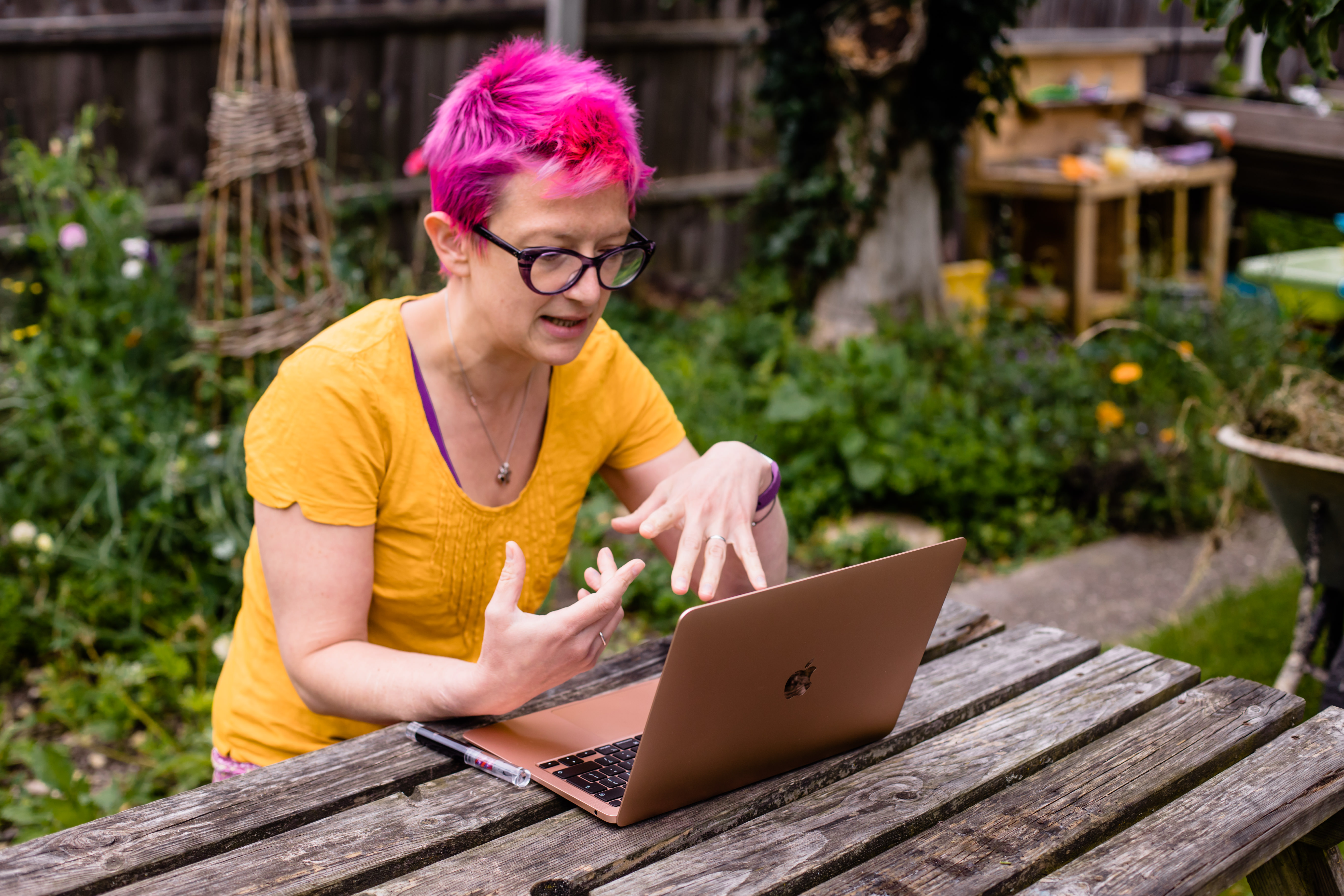 Picture of Dr Alice Nicholls working at laptop