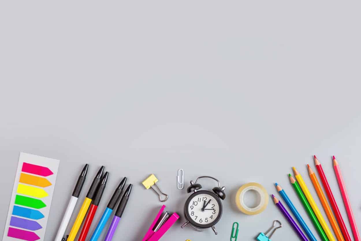 pens, colored pencils, clips, clock