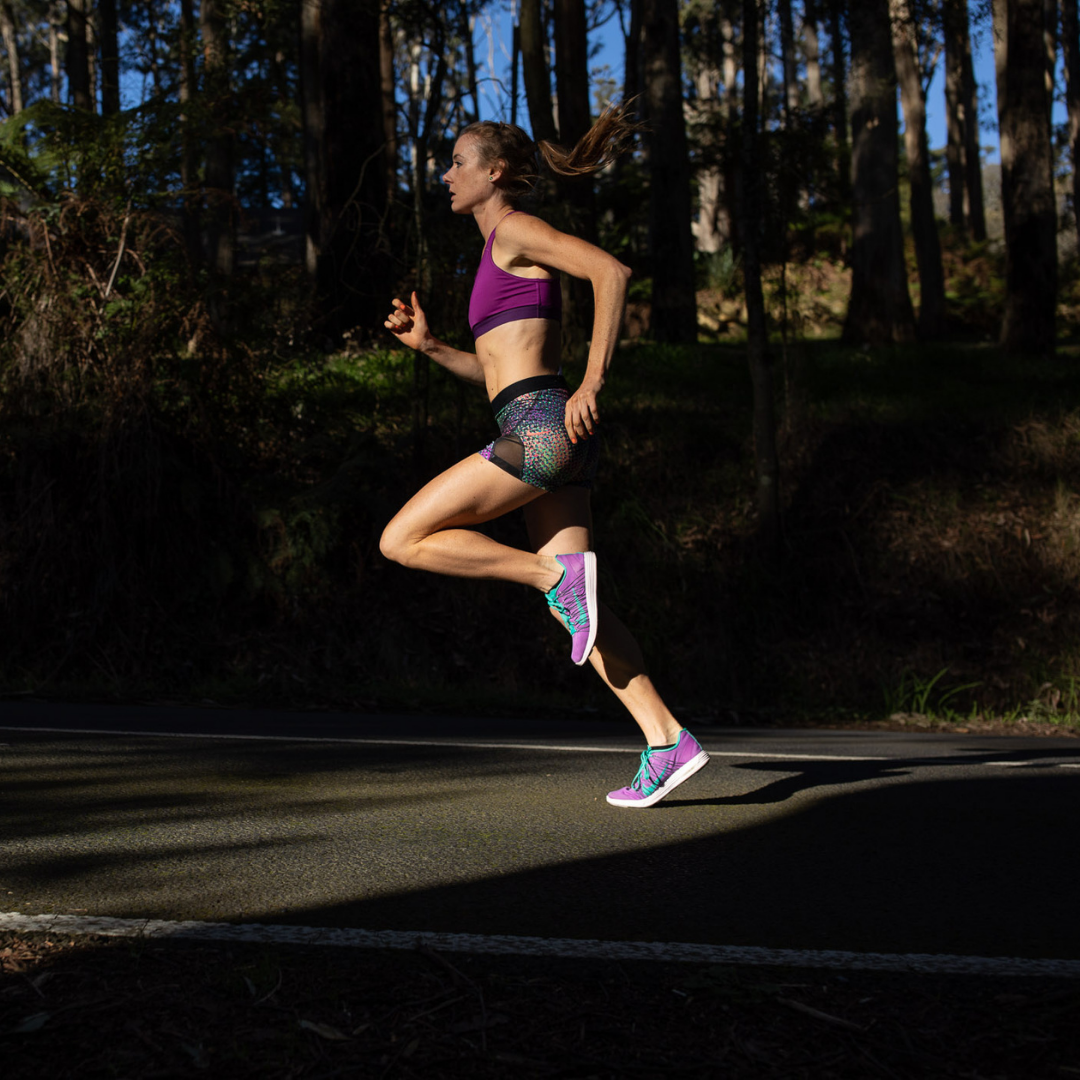 Woman running, performing knee pain recovery common in runners