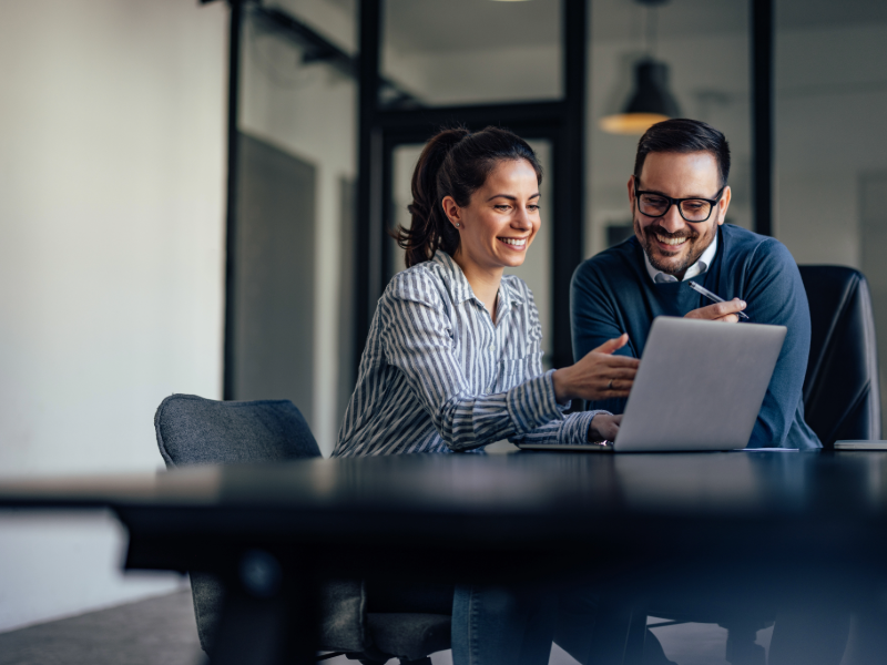 A business professional man concentrating on a plan with a coworker.