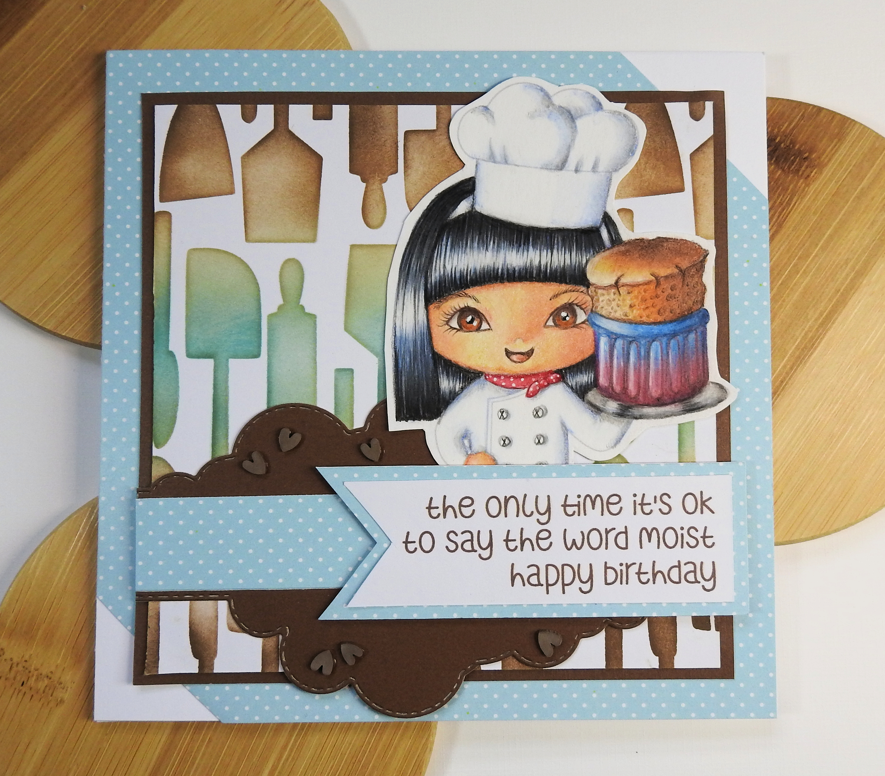 square card with a chibi chef girl holding a chocolate souffle&#39;