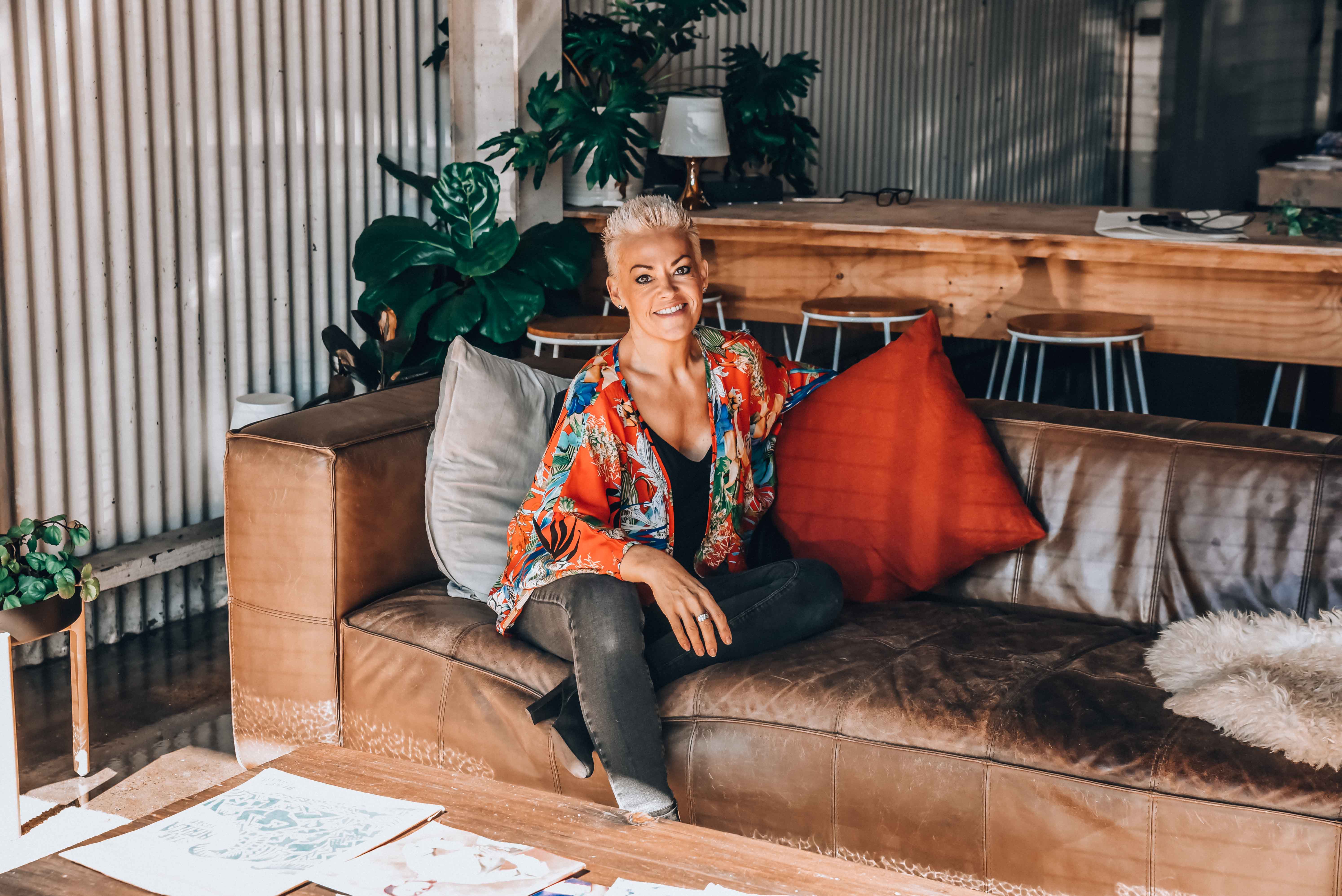 woman in red top on couch