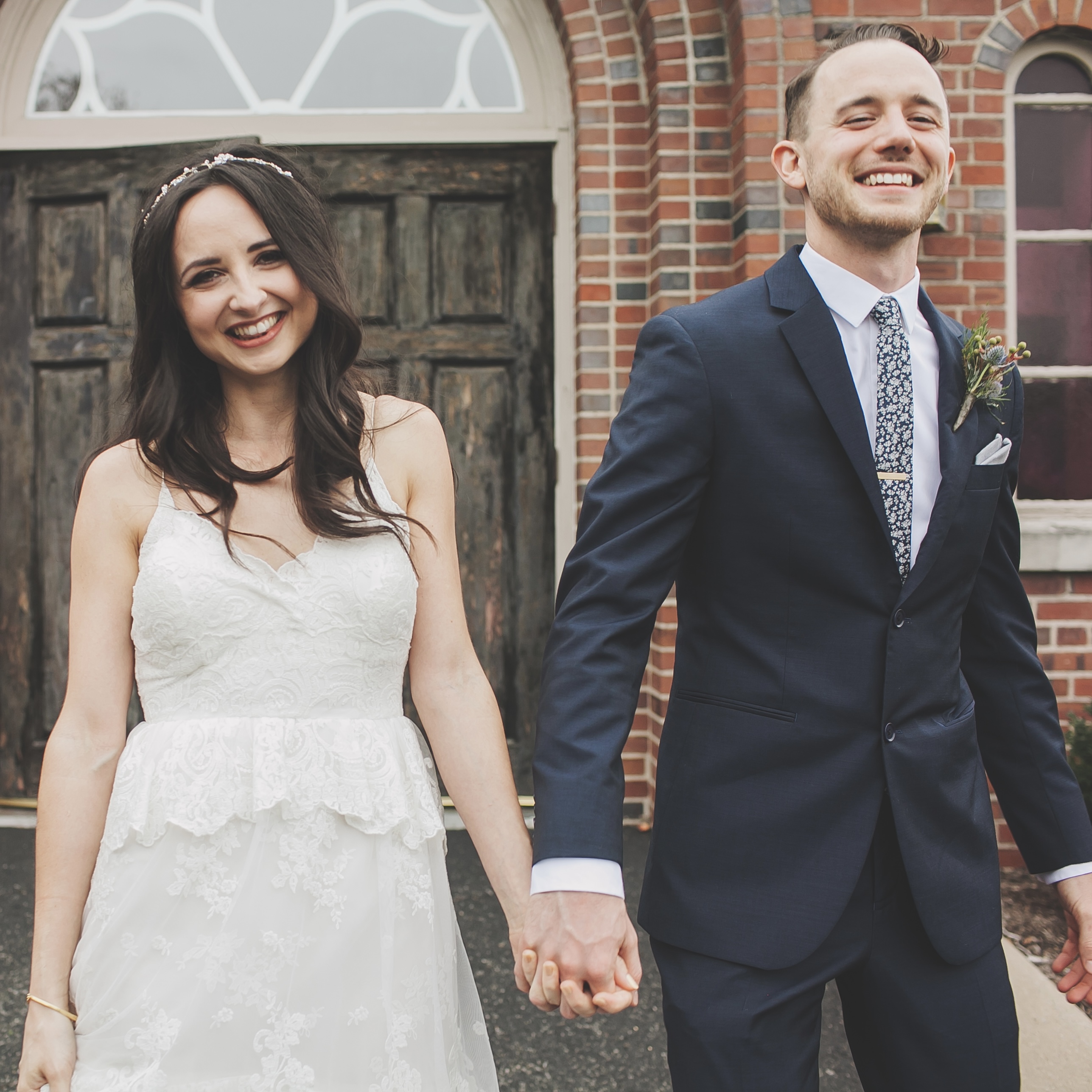 A young couple leave a church after getting married