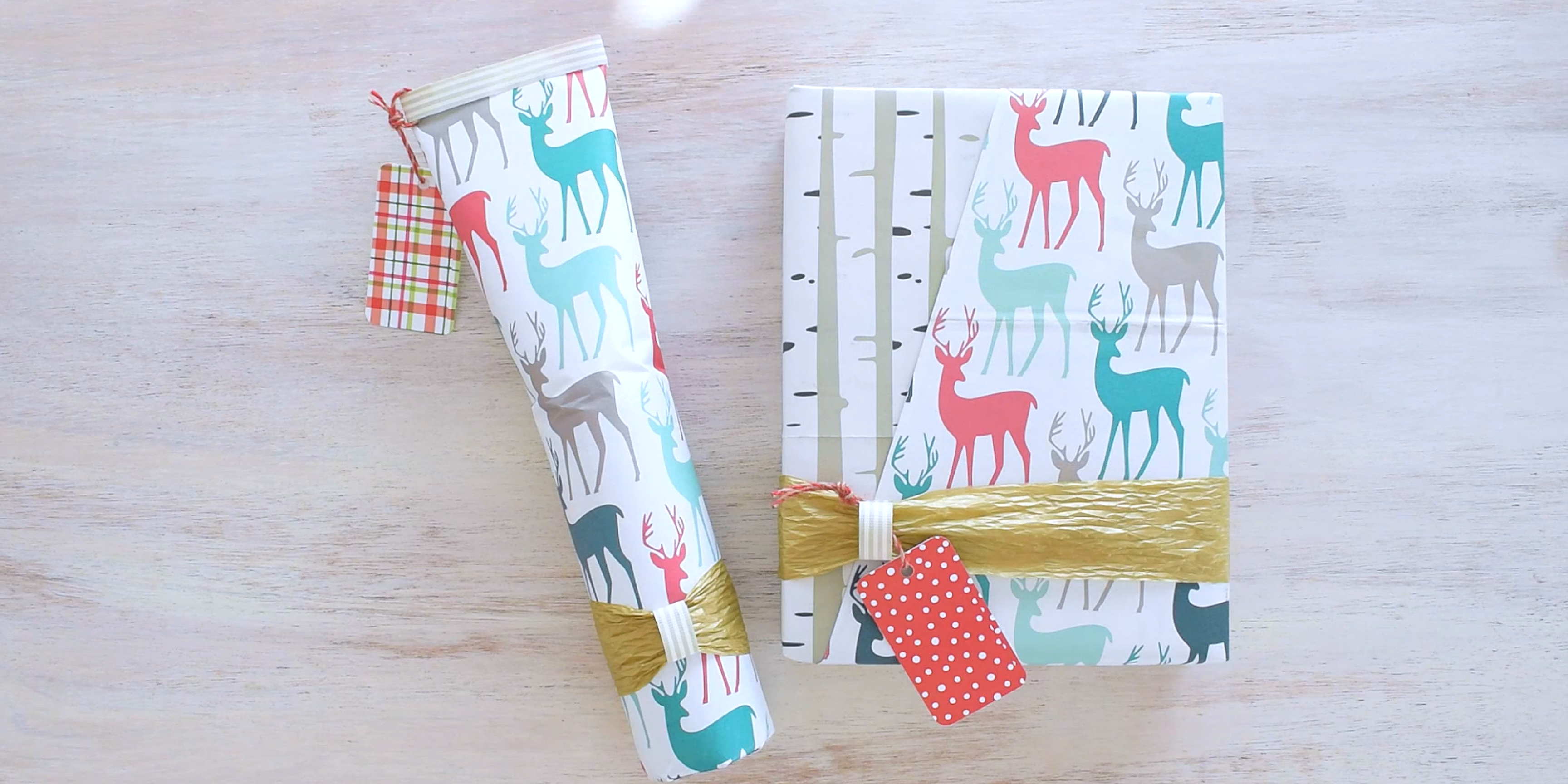 A bottle and a box wrapped in a deer patterned paper. 