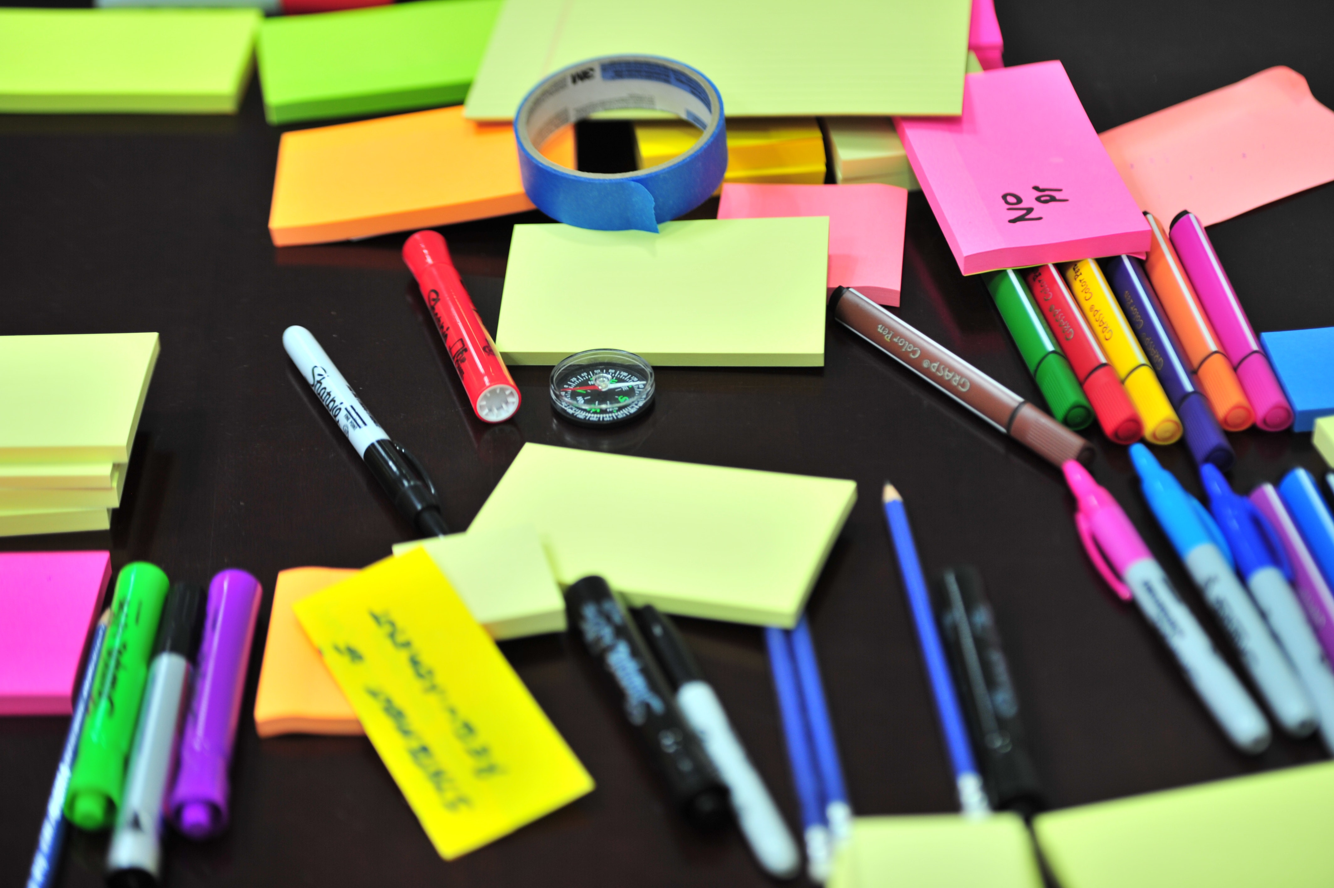 stack of markers and notepads