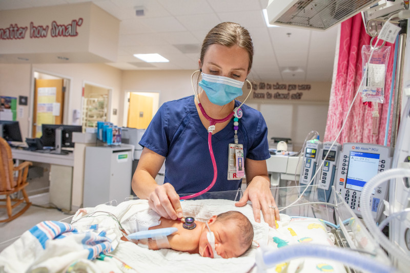 Medical team holding baby