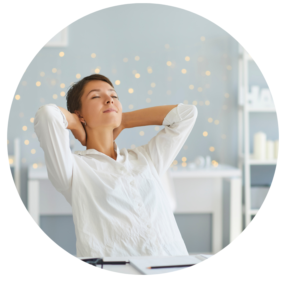 Woman relaxing at her desk.