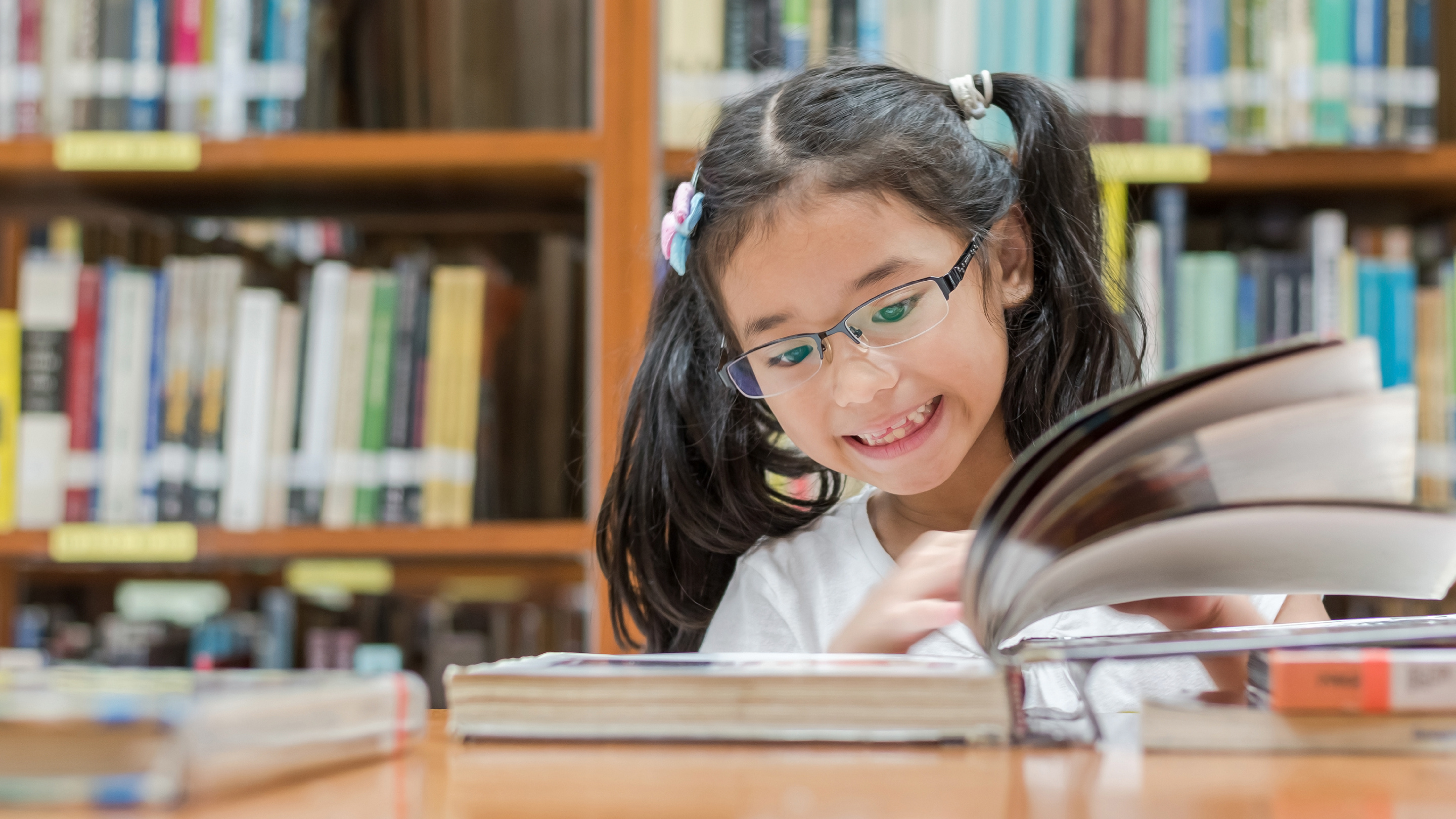 happy student reading a book