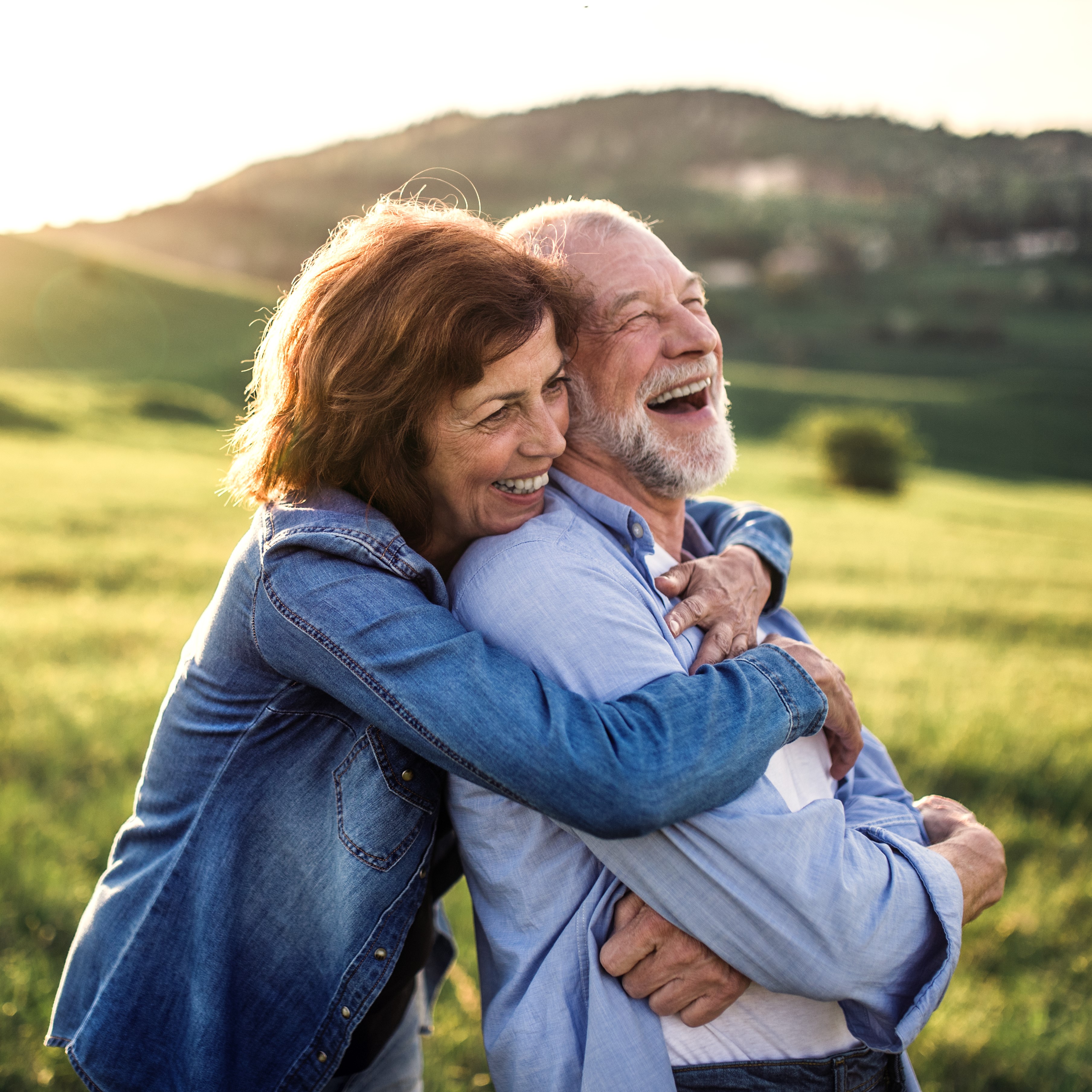 Retired couple hugging