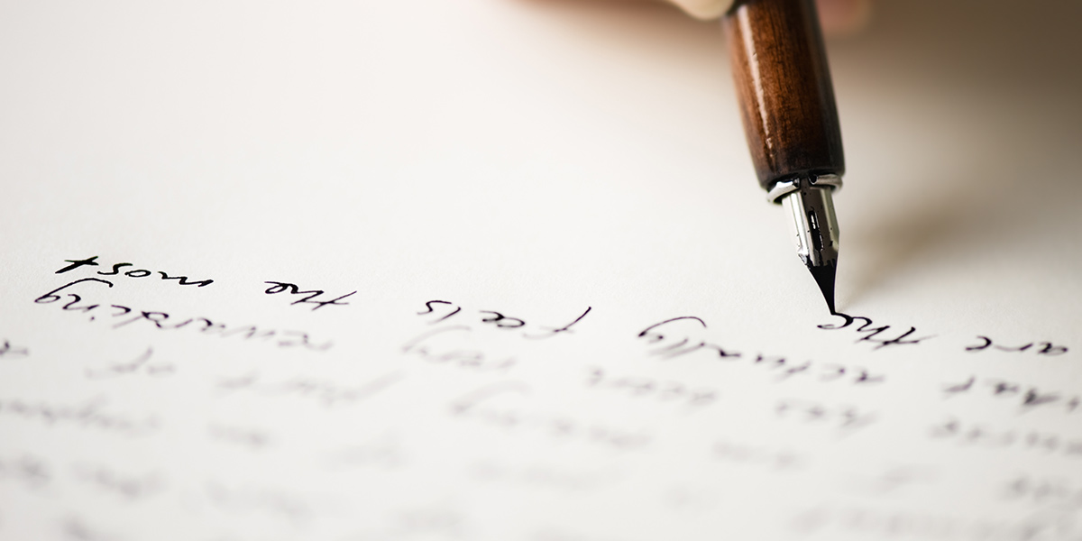 pencil with a jumble of letters streaming behind it