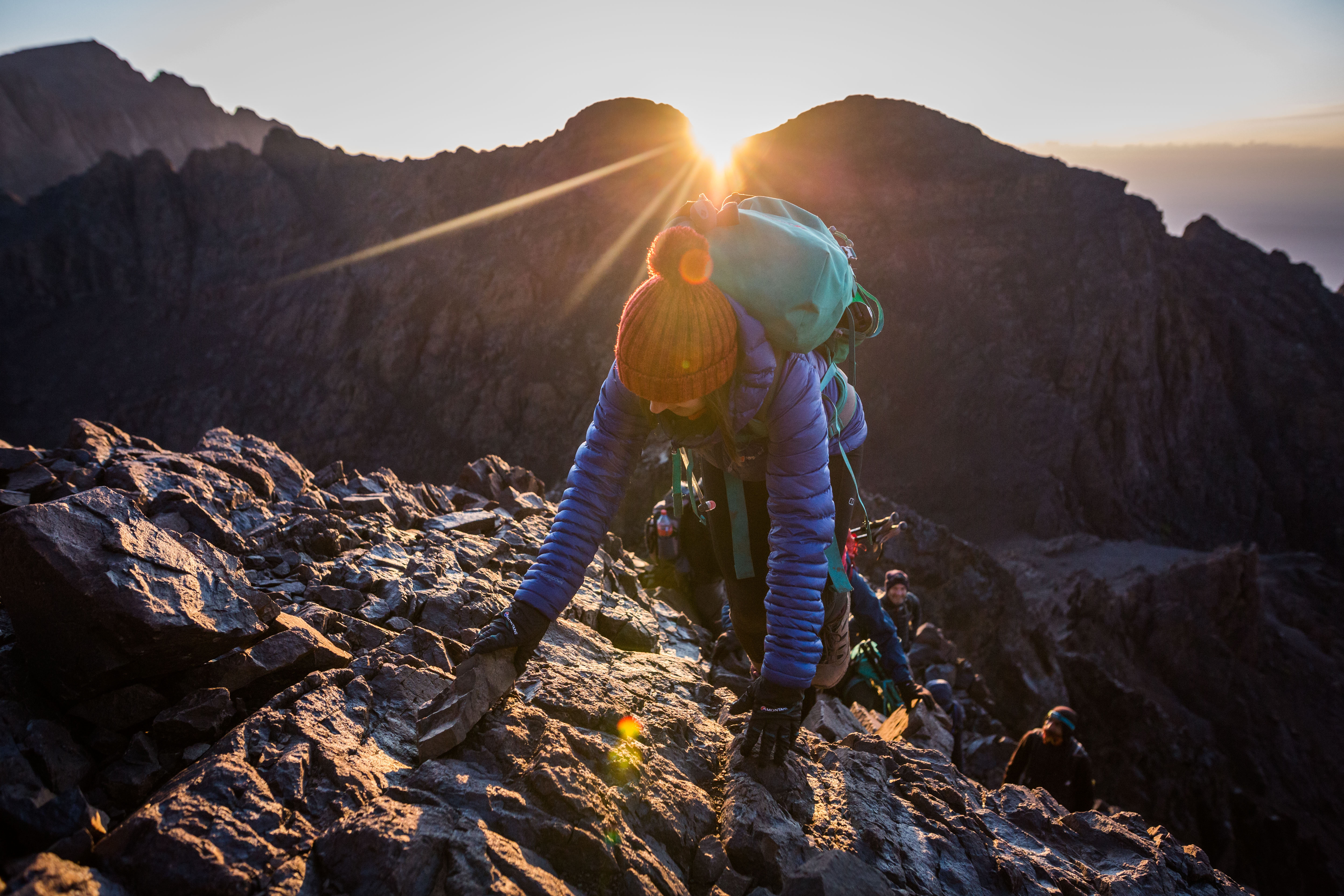 Woman scrambling in Morocco. Photo by Jessie Leong https://www.jessieleong.co.uk