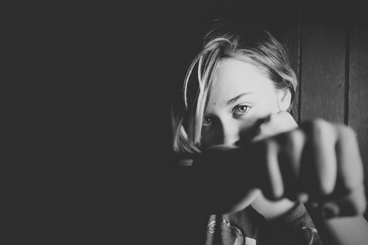 Woman, self defence, punch, black and white