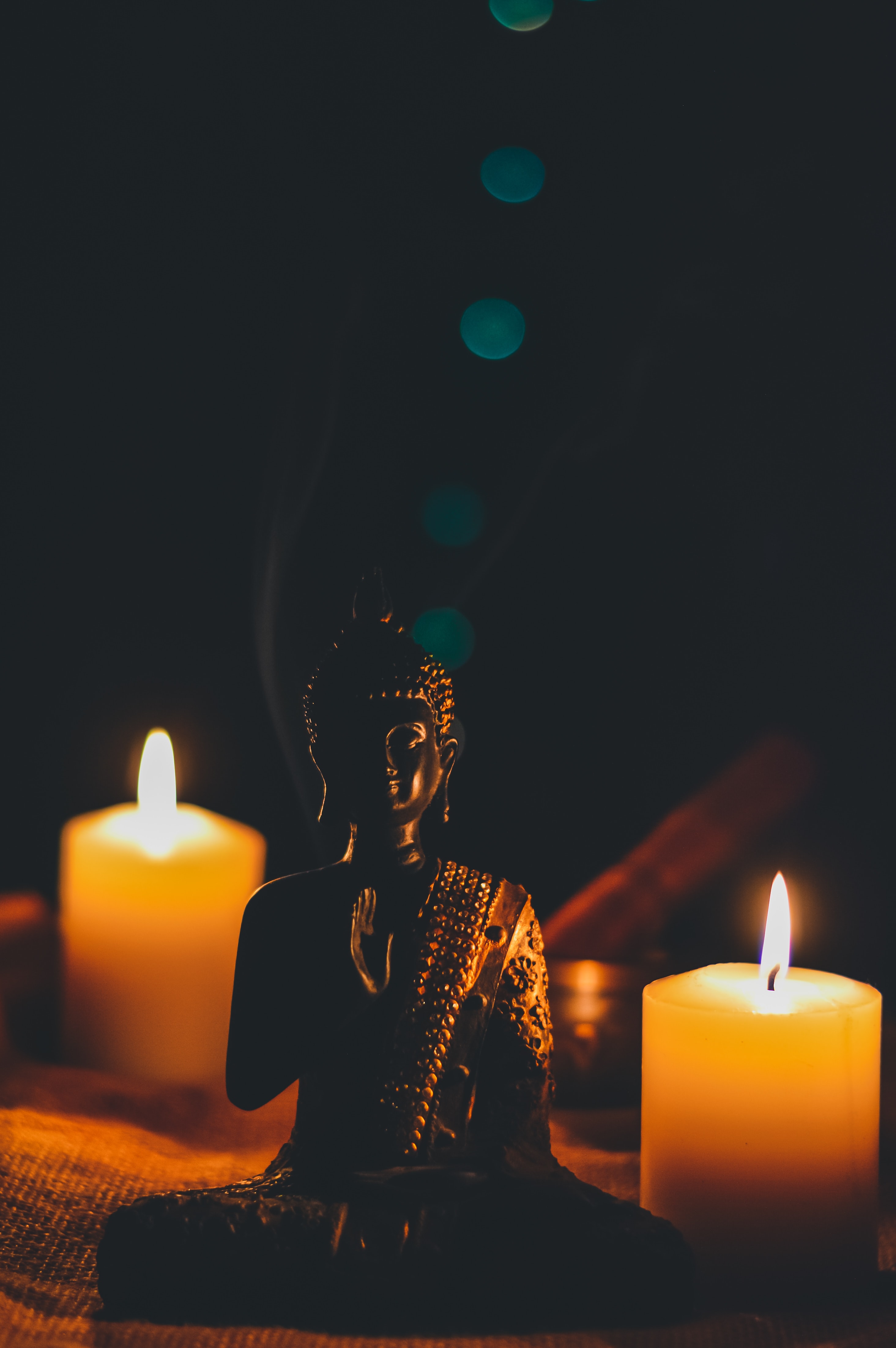 Buddha statue with two candles