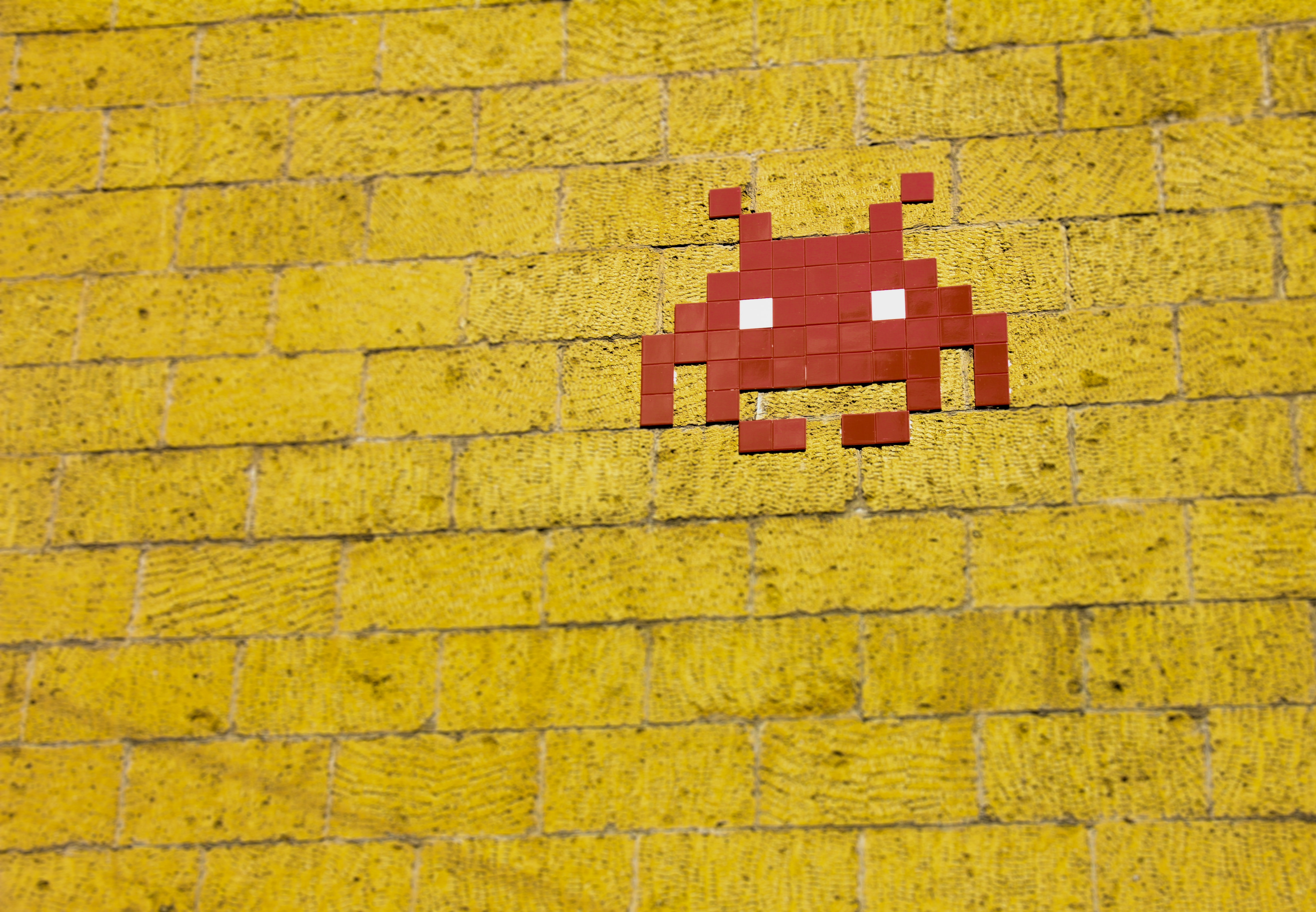 yellow brick wall with red avatar