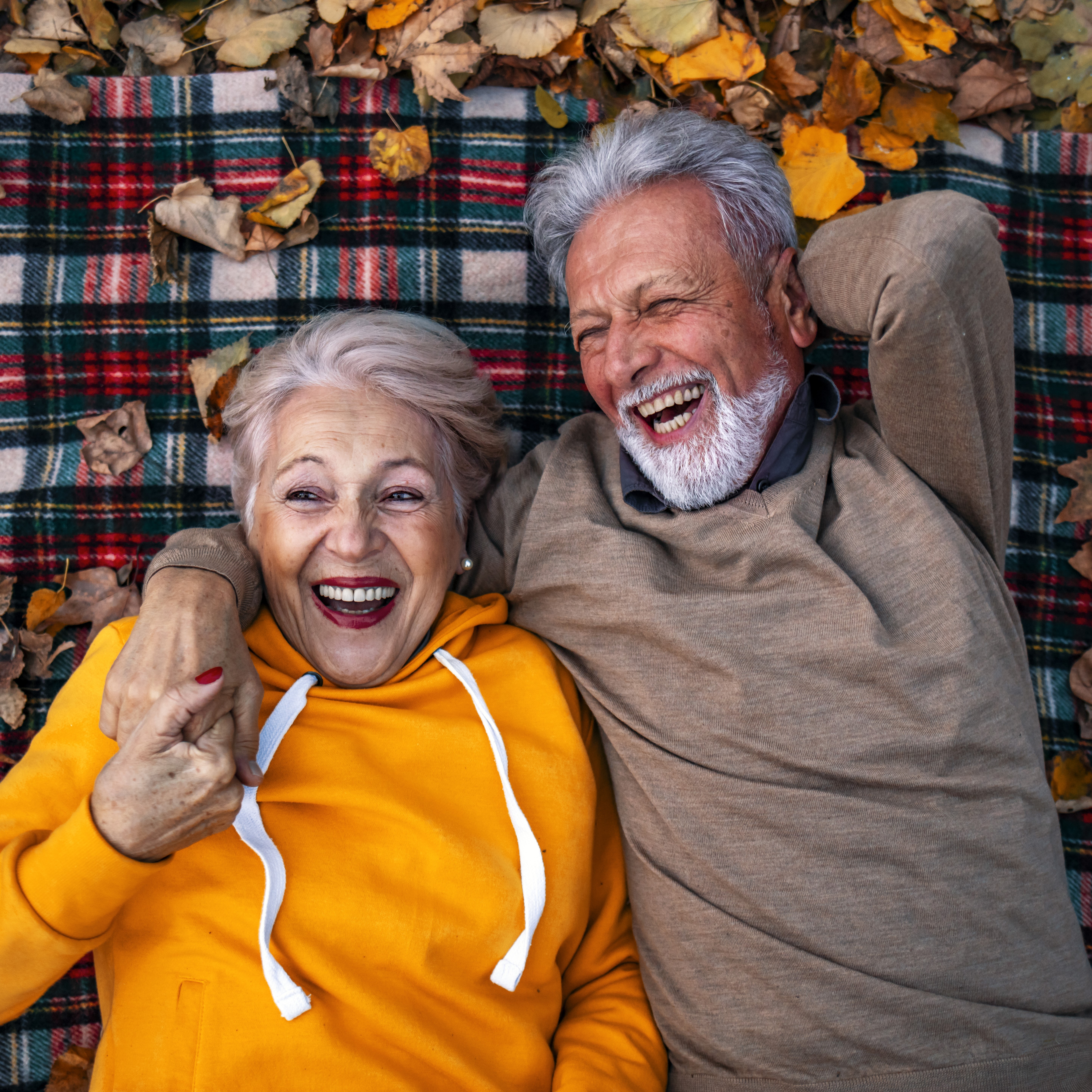 Senior couple on a blanket with leaves