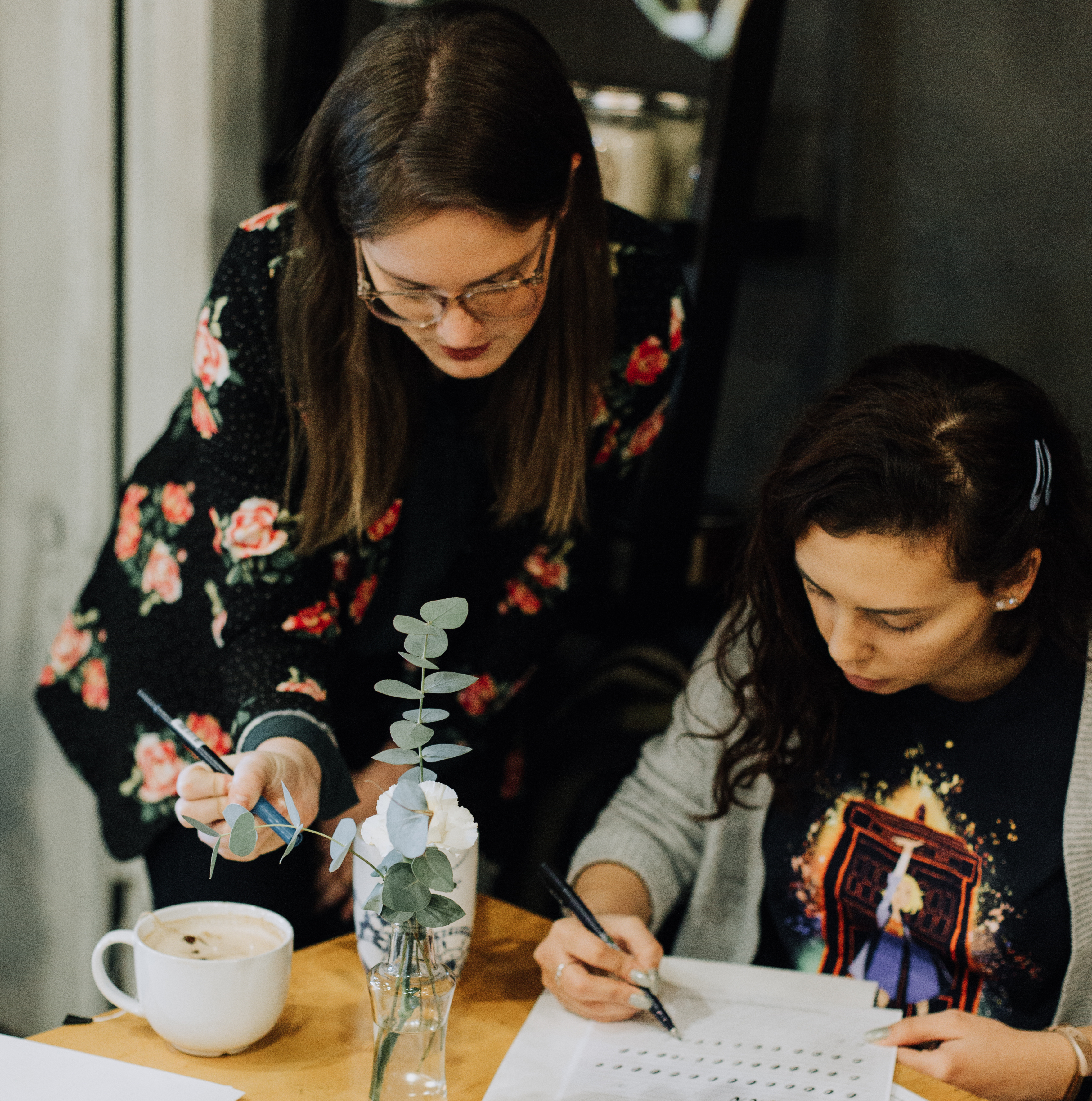 Calligraphy Instructor and student in workshop