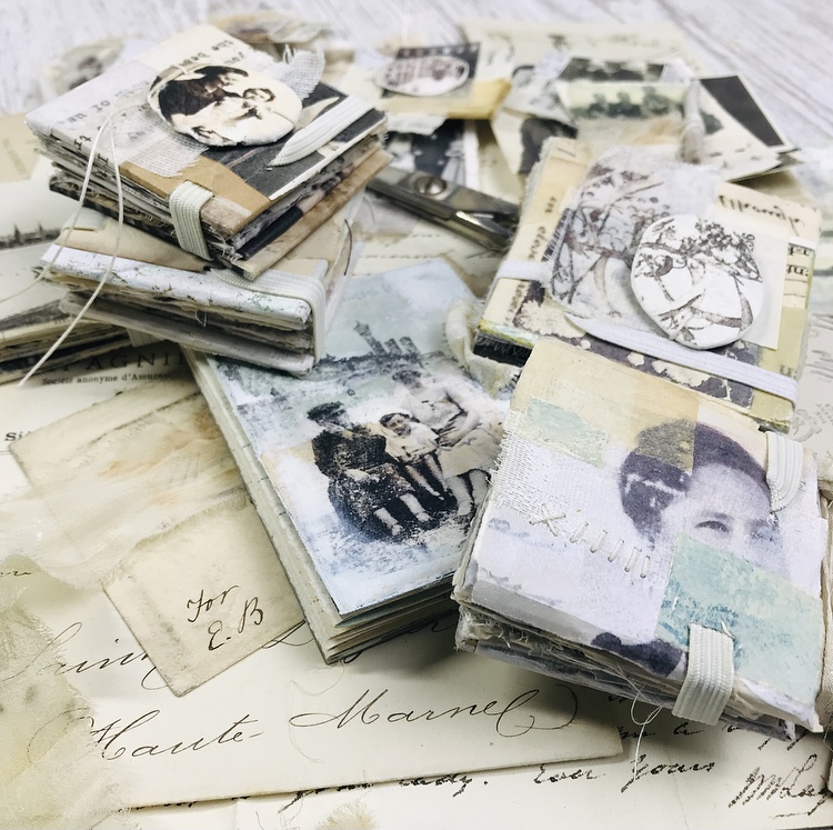 Pile of small handmade concertina books