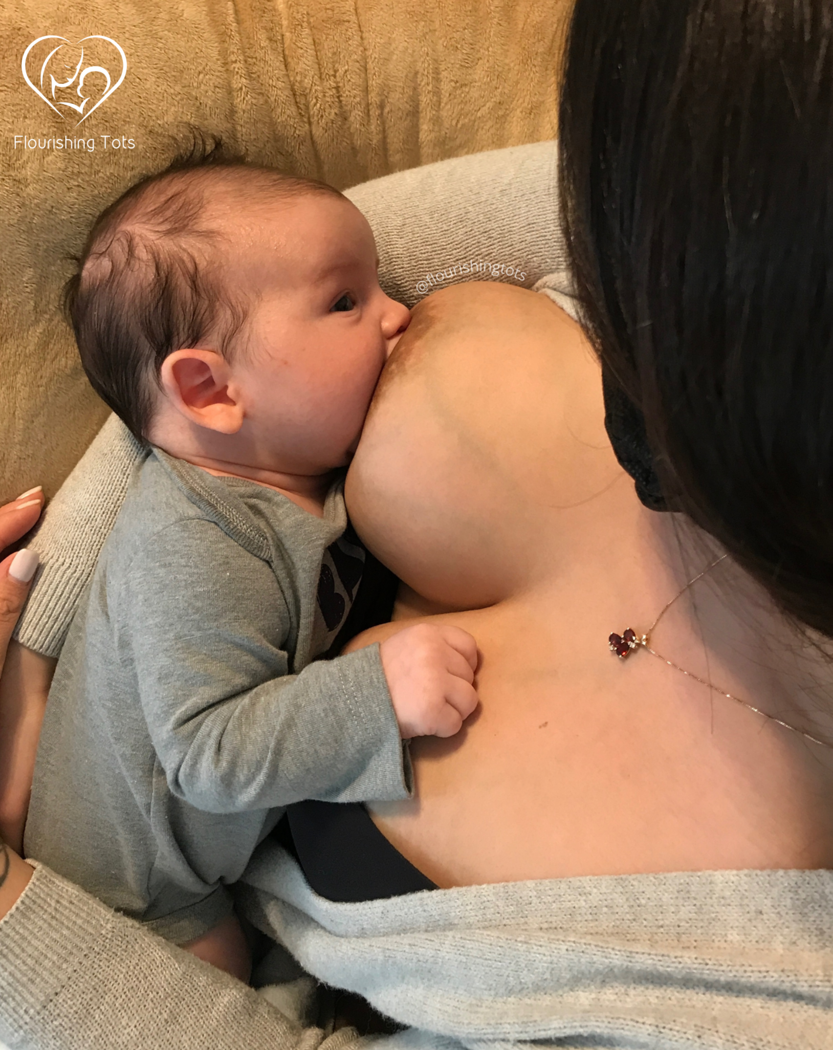 baby with wide latch nursing while gazing up at his mom