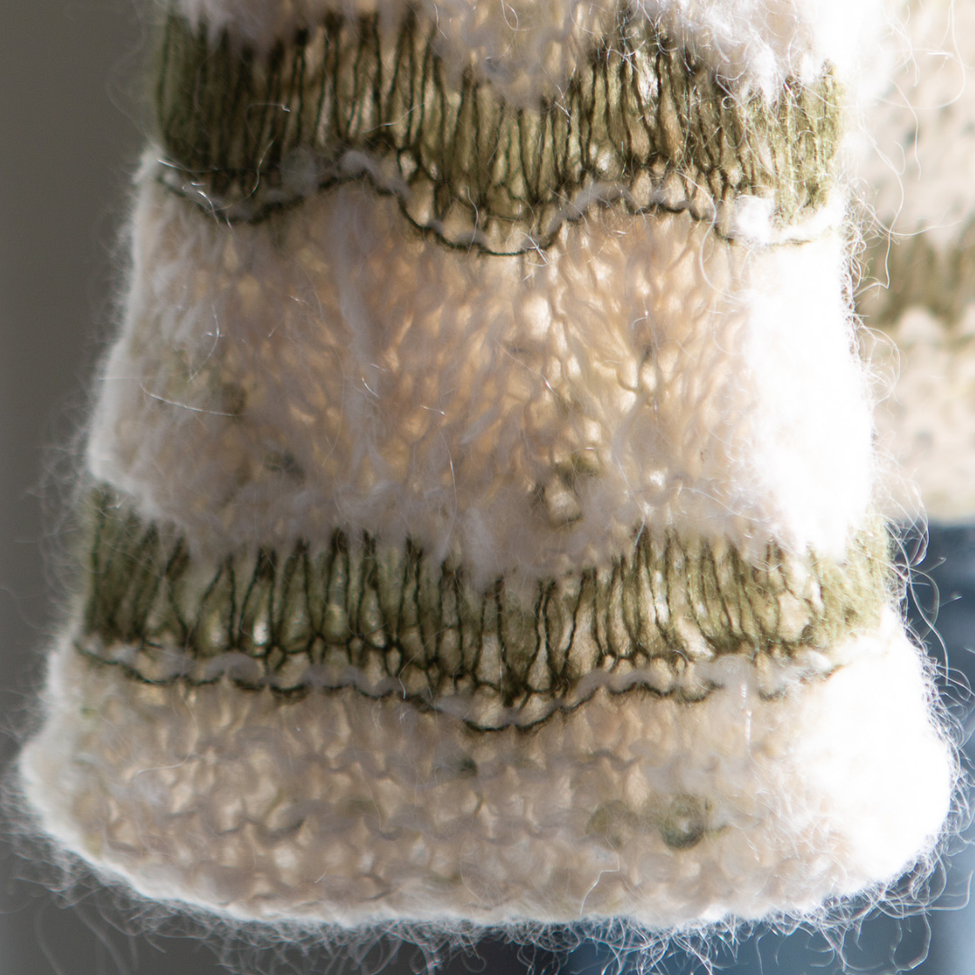 Up close look at the dropped stitches on the sleeve of the sweater.