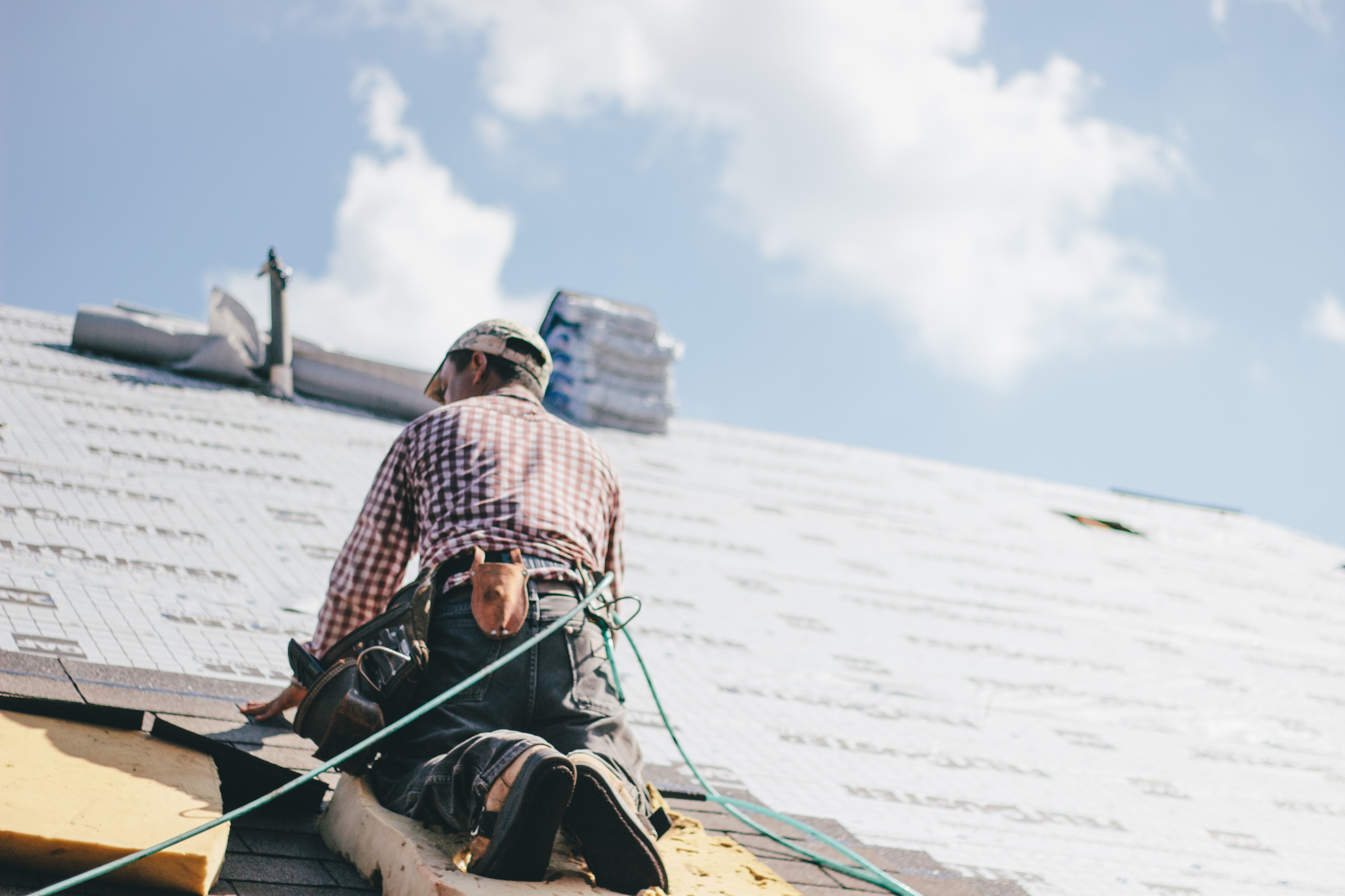 Roofer Repairing Roof