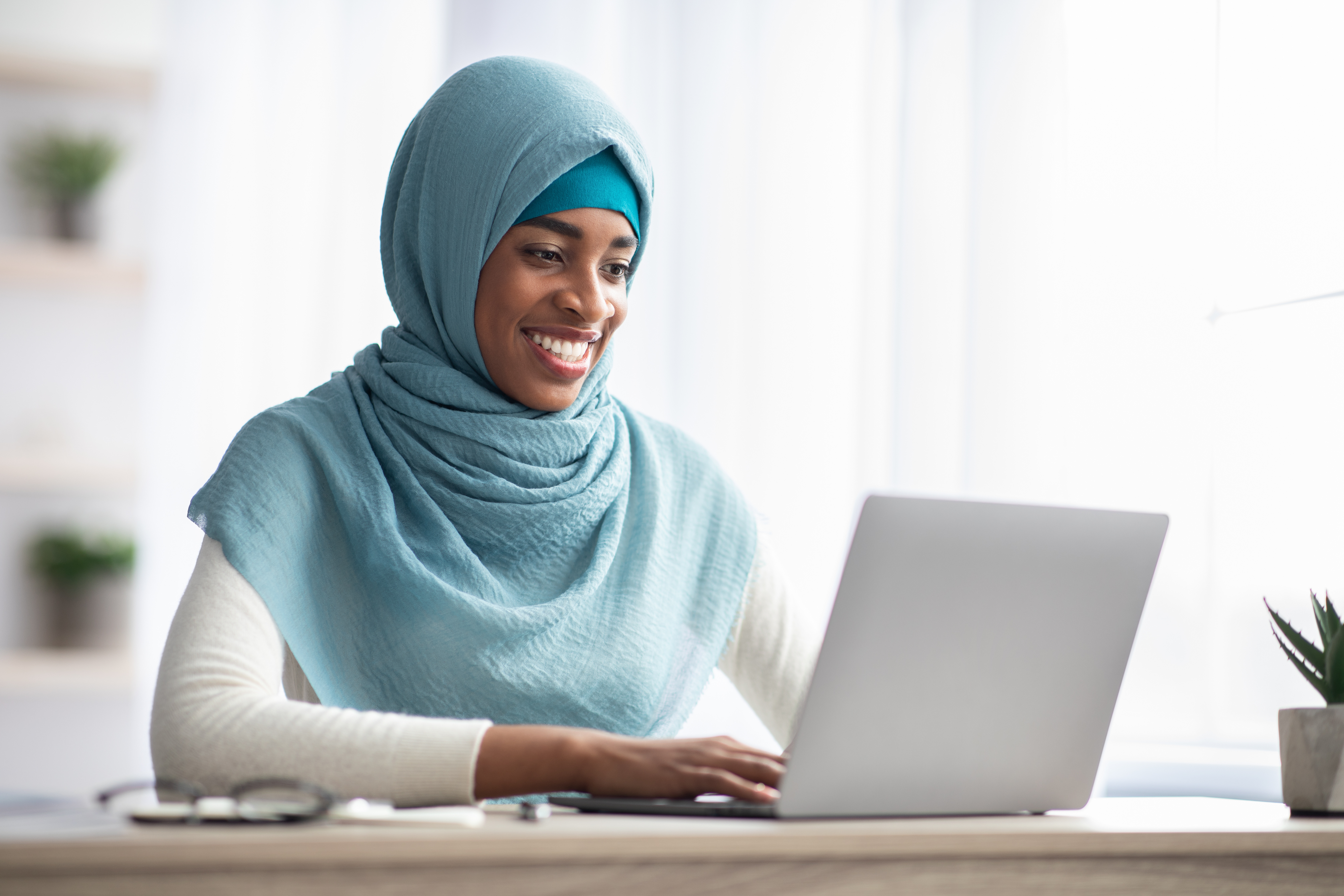 black muslim woman studying online