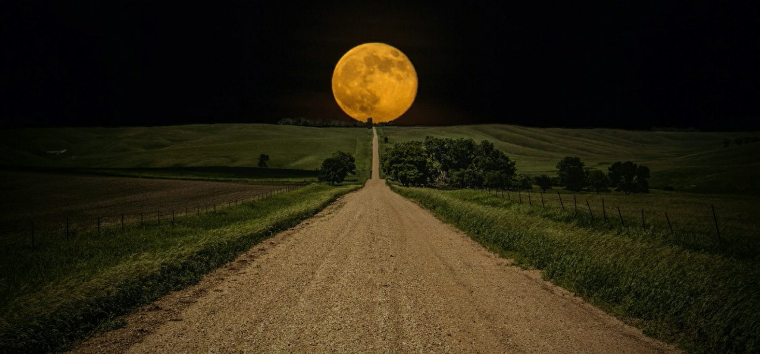 Large Full Moon in Mountain Range Sky