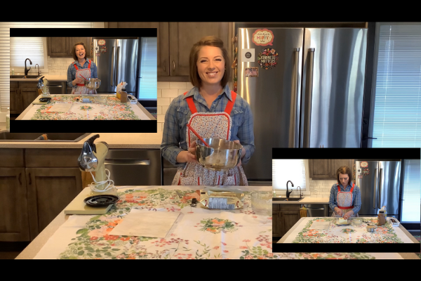 Me in a fabulous vintage apron explaining how to make cinnamon buns