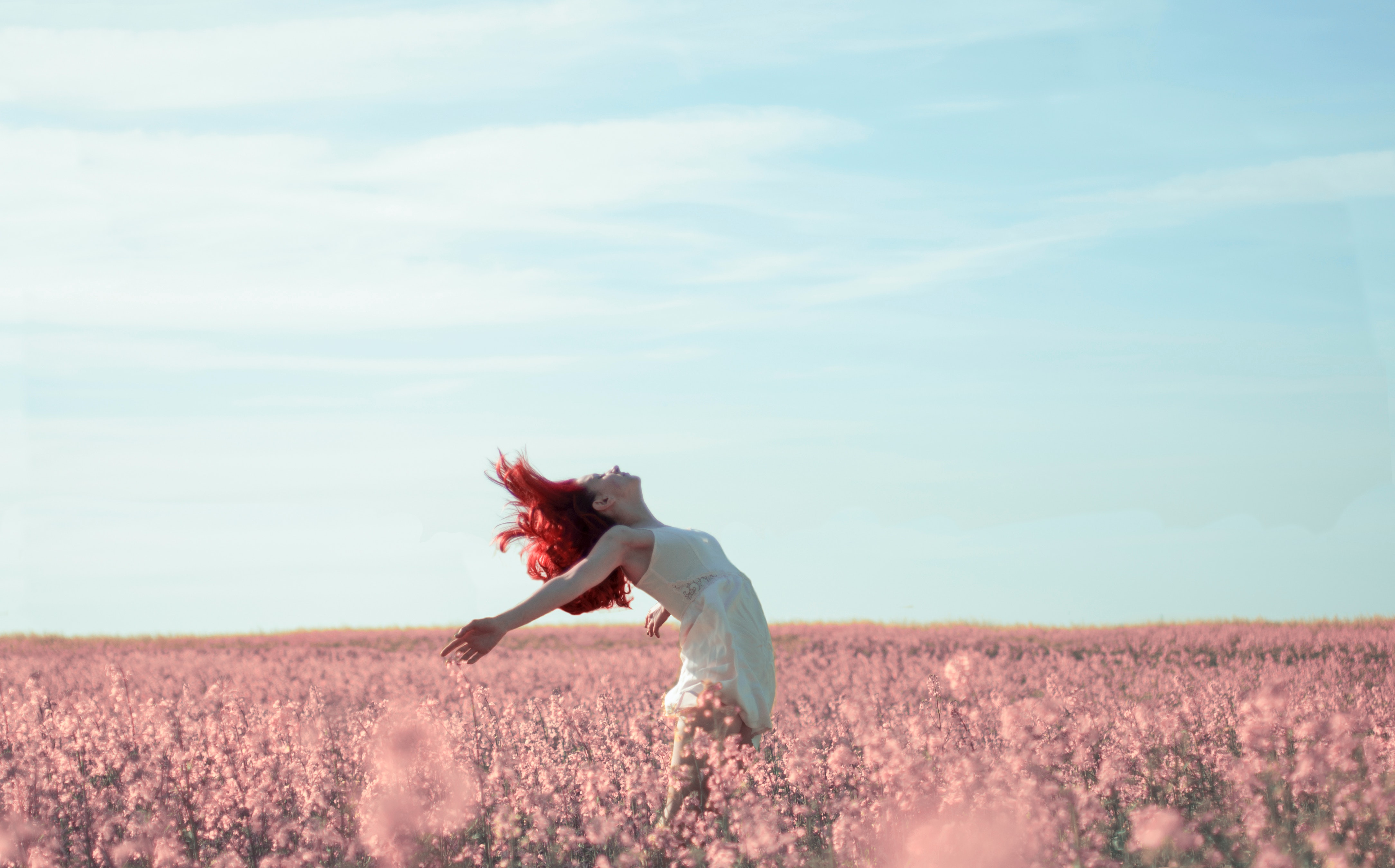 A woman dancing in a field