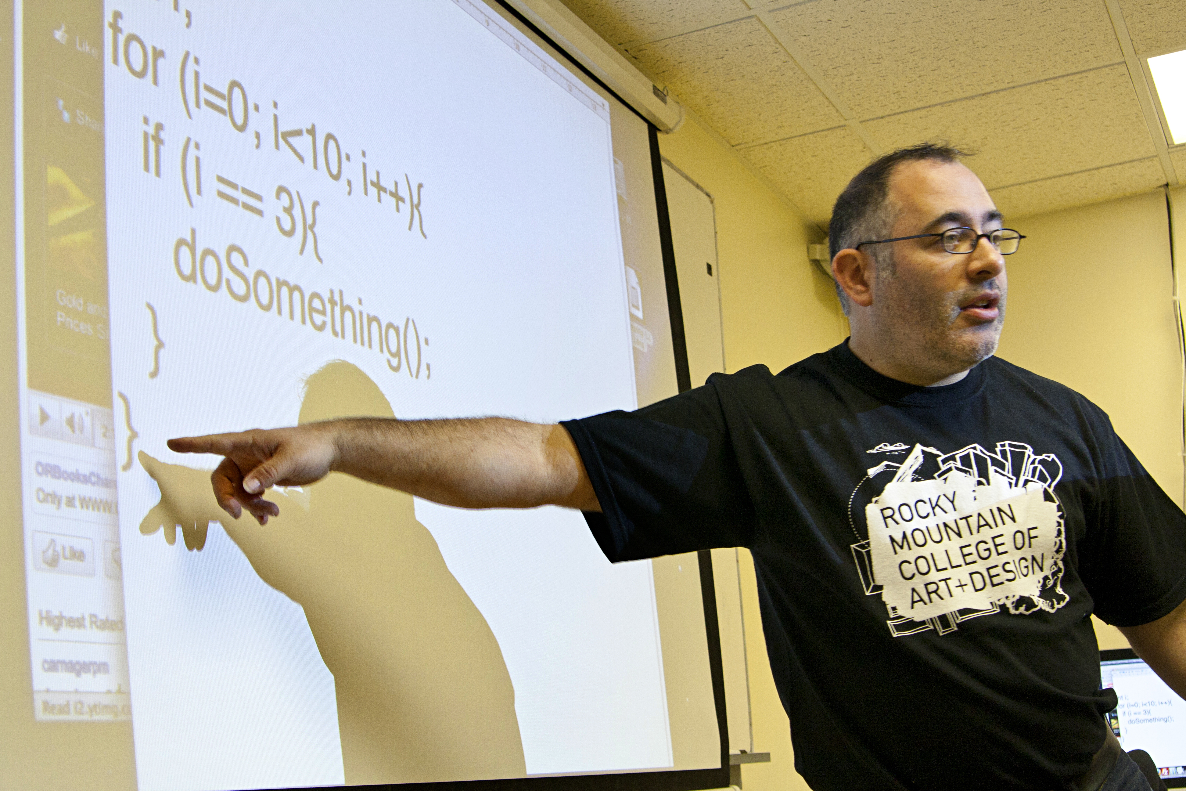 An image of a man pointing to a video lecture