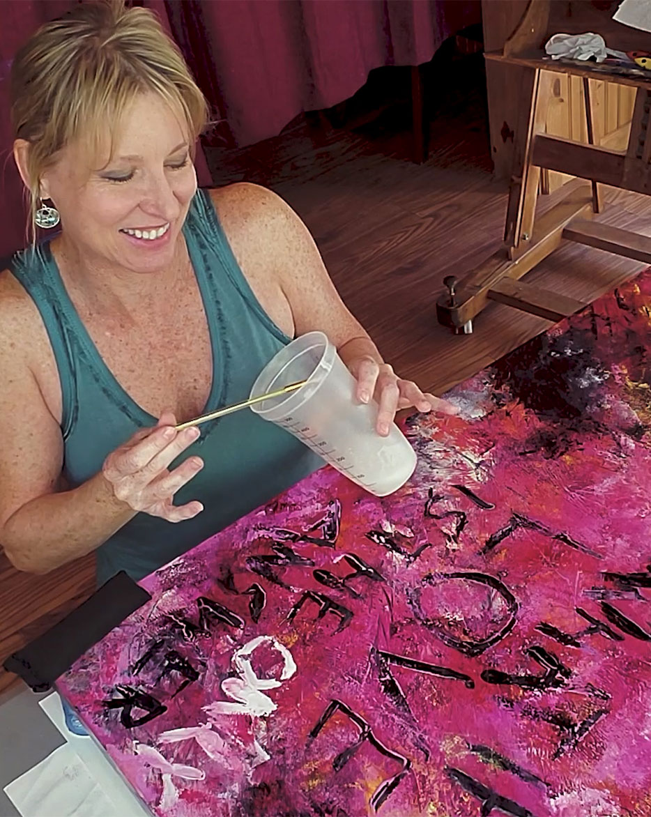 Michelle Lee painting an abstract