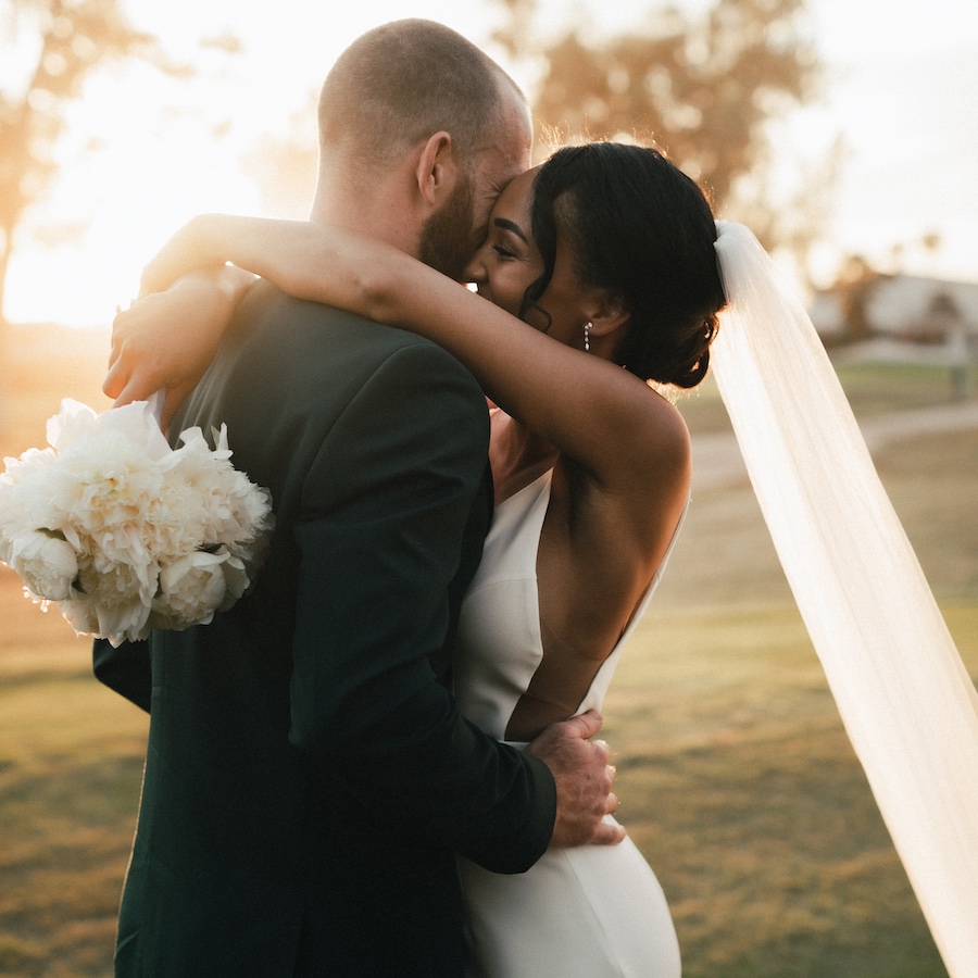 A young couple hold hands