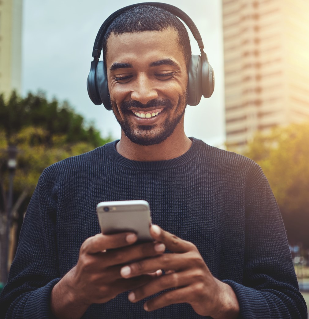 Man with phone and headphones