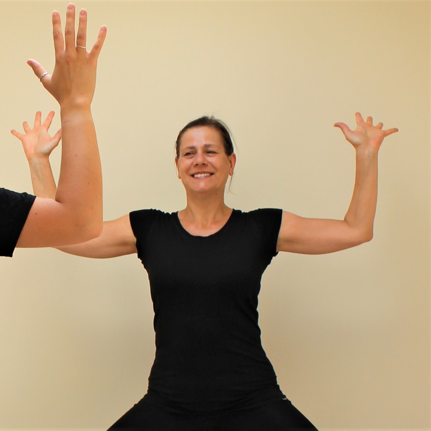 Yoga Teacher Deb King teaching Cactus Pose
