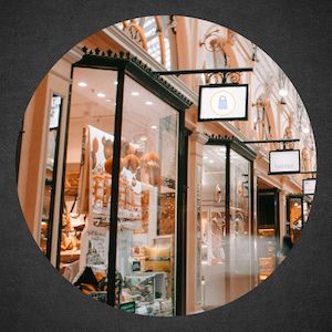 photo of row of shops in a busy mall