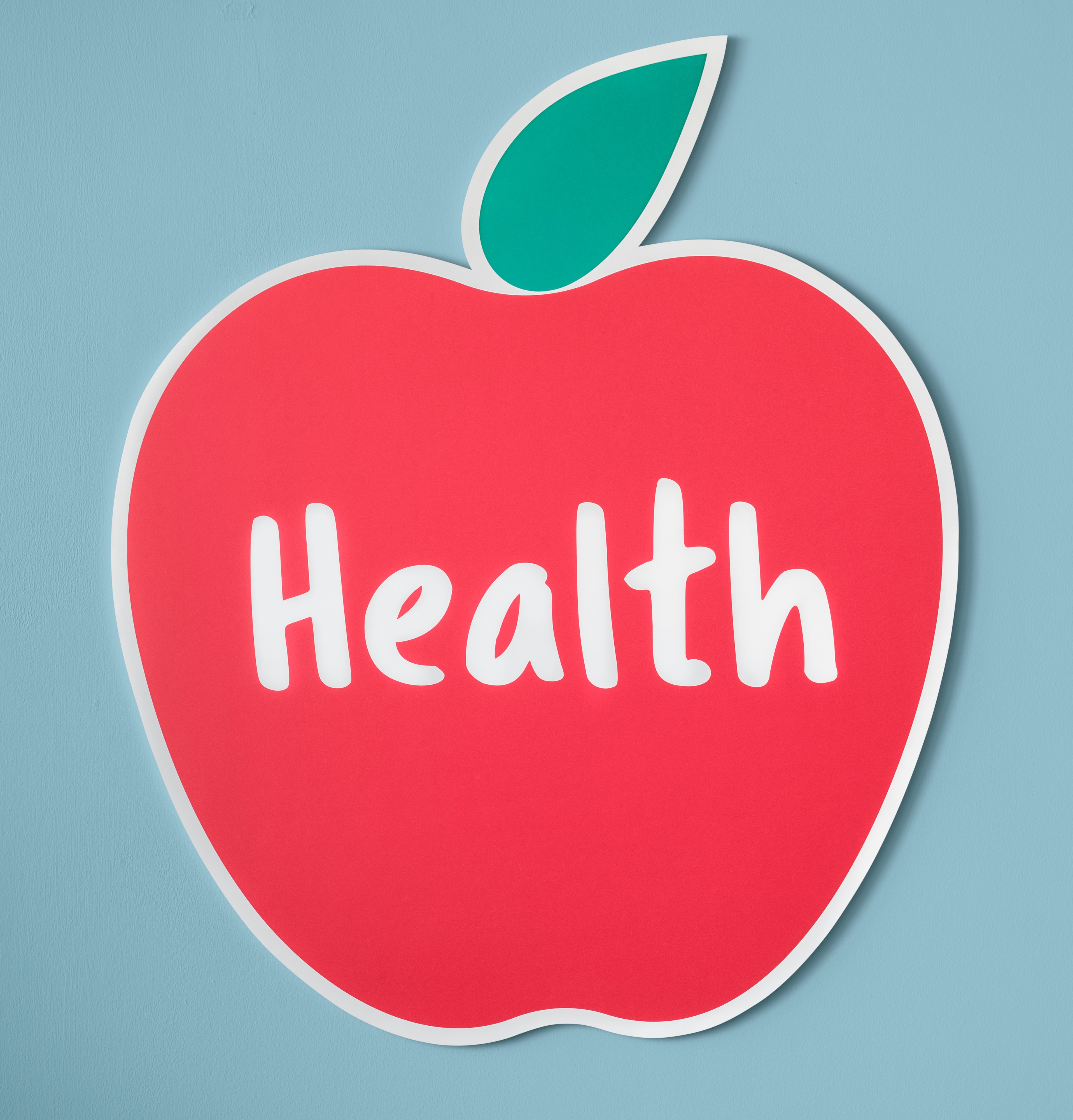 Red Apple white outline, blue background, Word Health in the middle of apple.