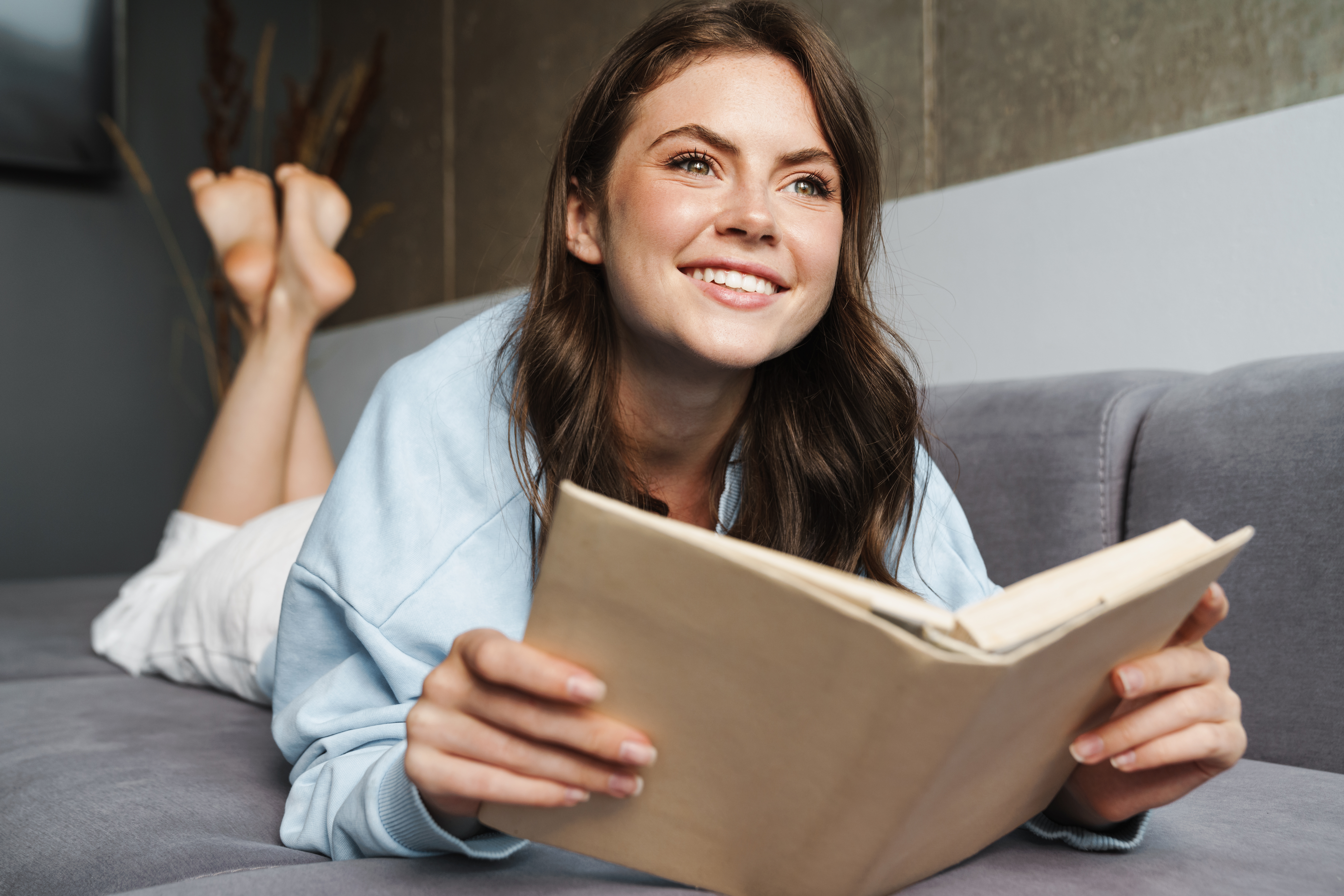 Teen girl happily reading