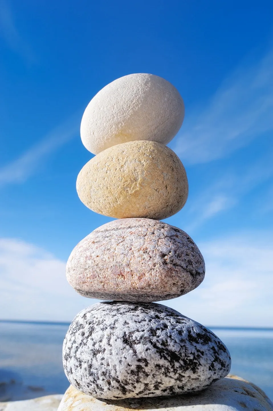 zen rocks stacked on beach