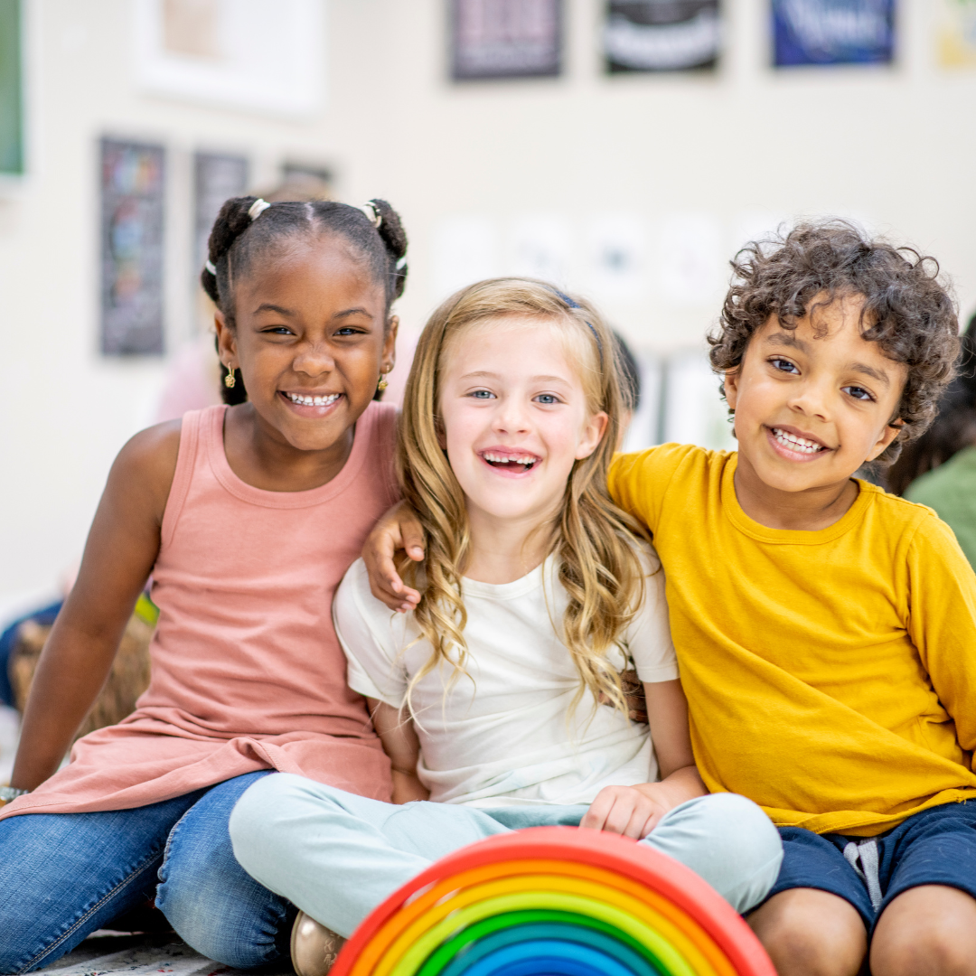 three kids smiling