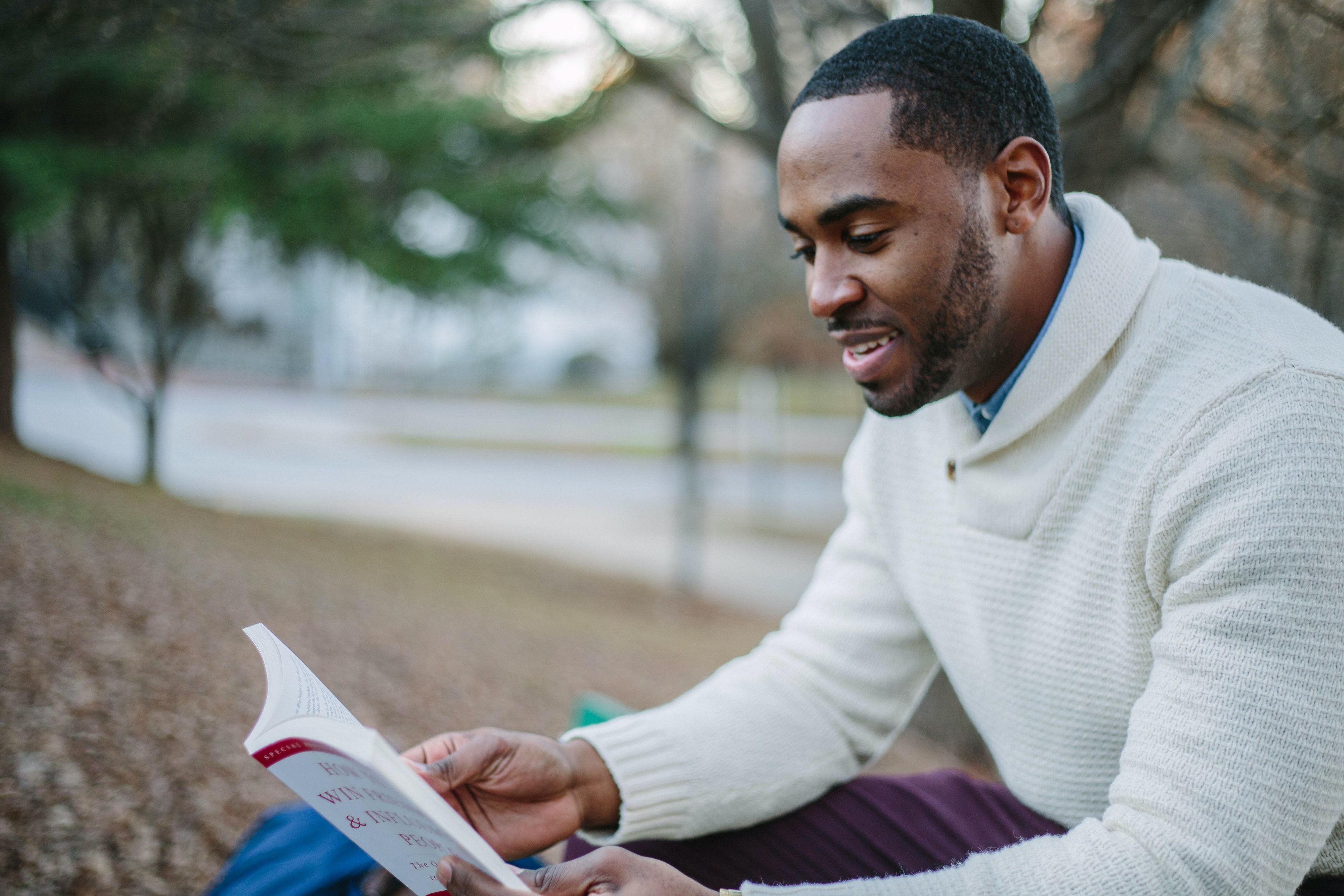 Individual studying a personal development book