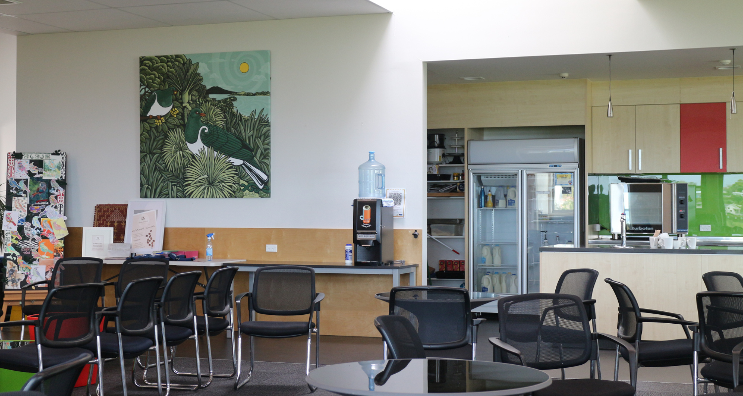 School staffroom with chairs, tables and kitchen