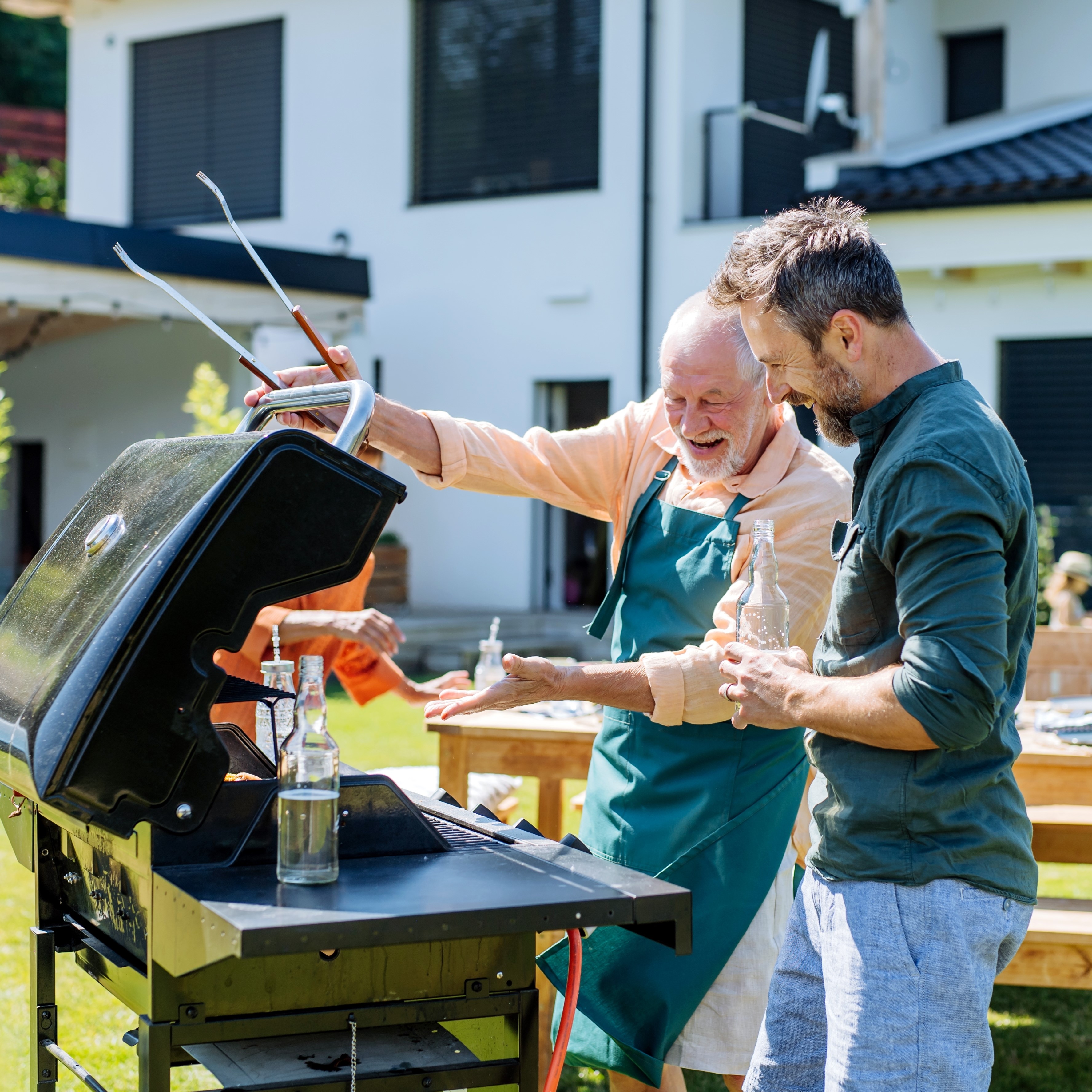 Father and son grilling