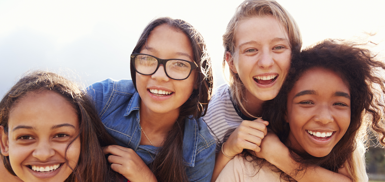 Diverse teen girls having fun learning life skills