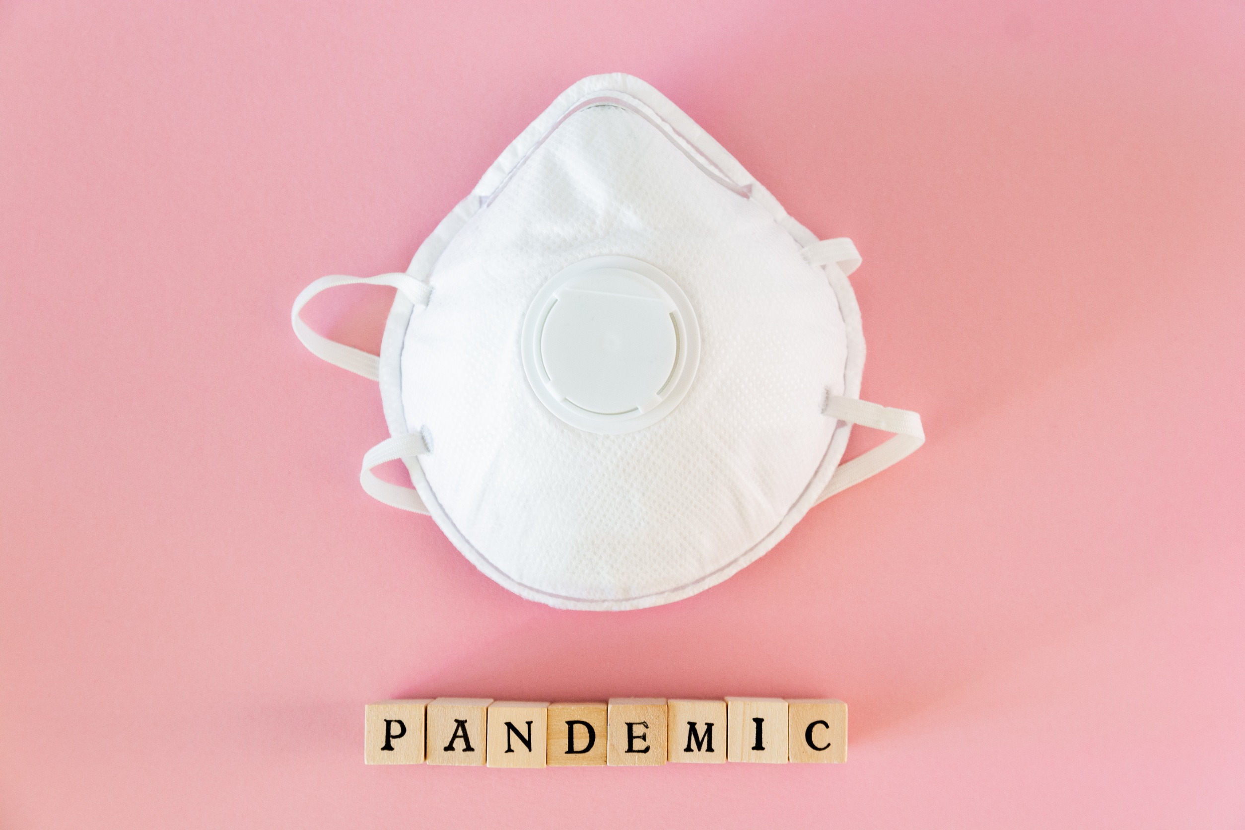 mask with the word pandemic under it